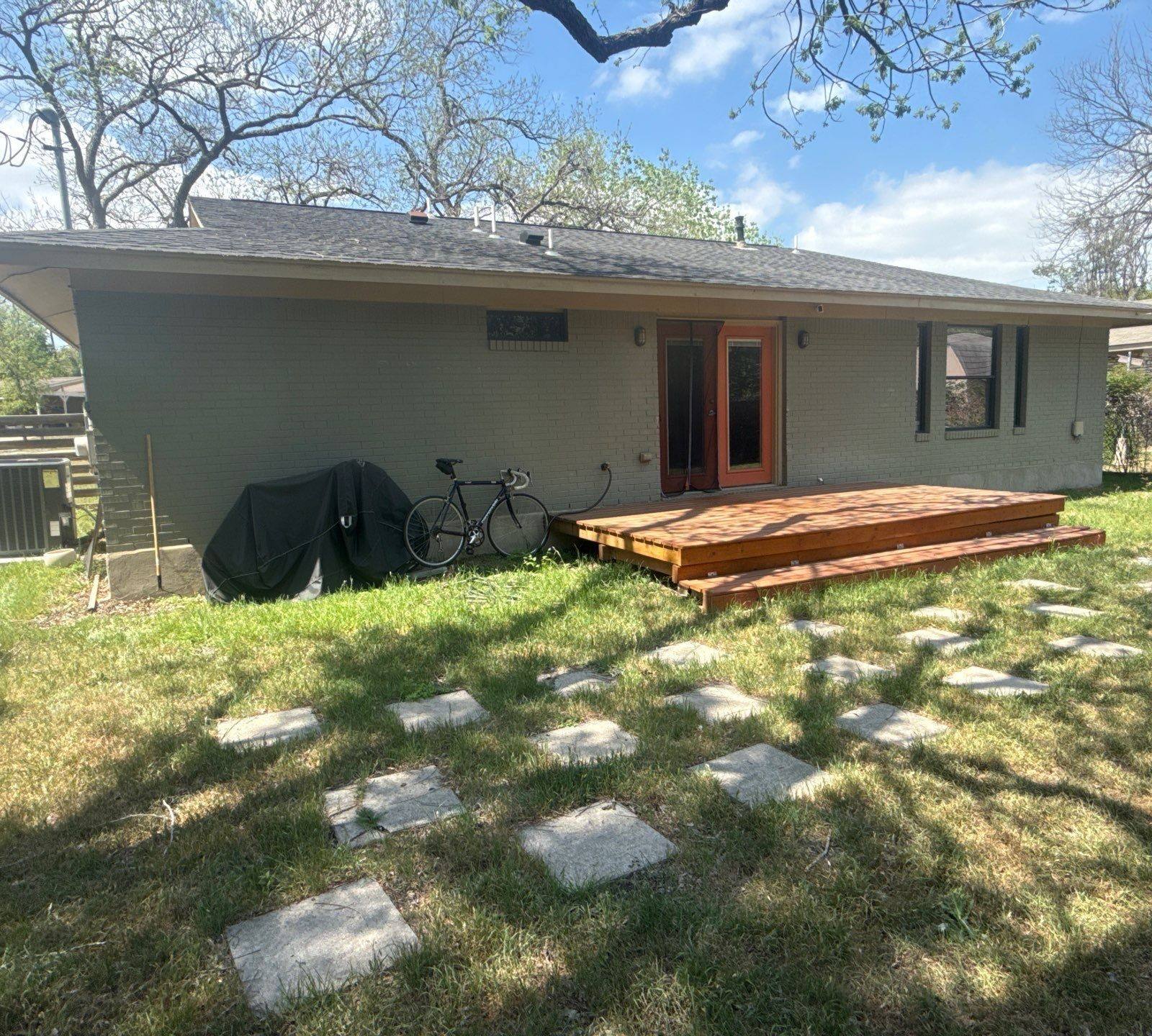 Back exterior and deck ahead of painting in Austin, TX by Hill Country Painting
