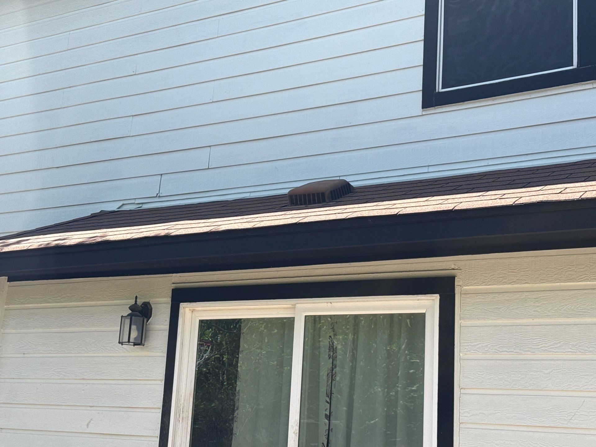 Exterior siding ahead of repair work in Hutto, TX by Hill Country Painting