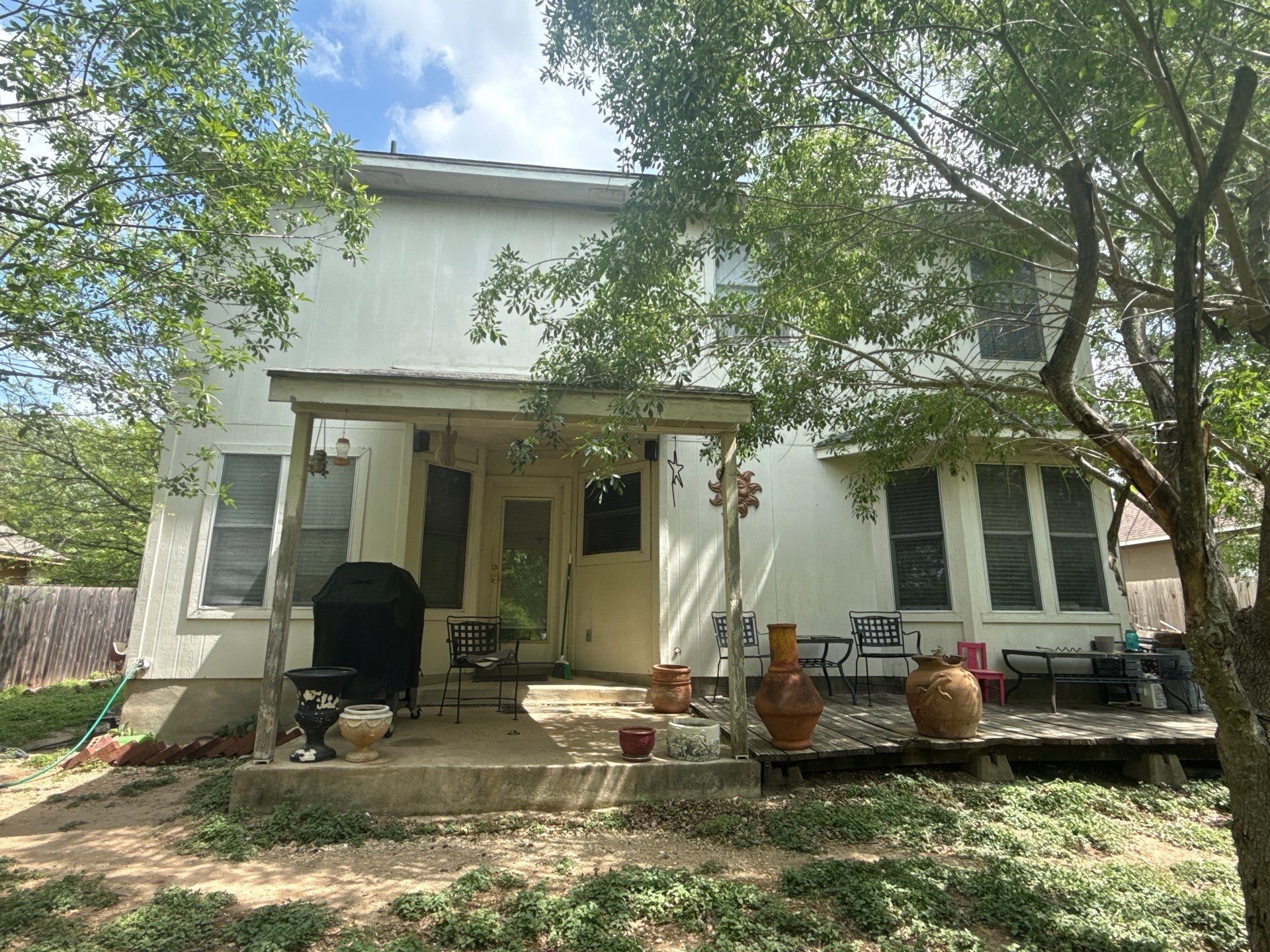 Back exterior ahead of painting in Hutto, TX by Hill Country Painting