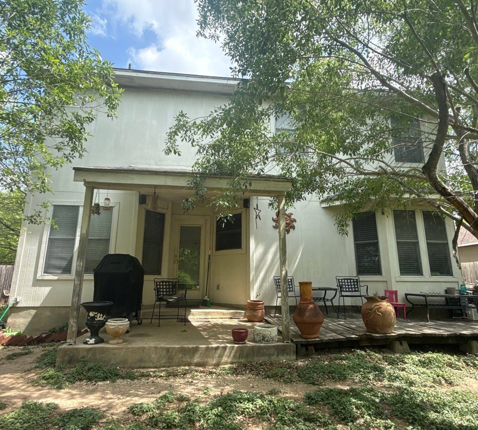 Back exterior ahead of painting in Hutto, TX by Hill Country Painting