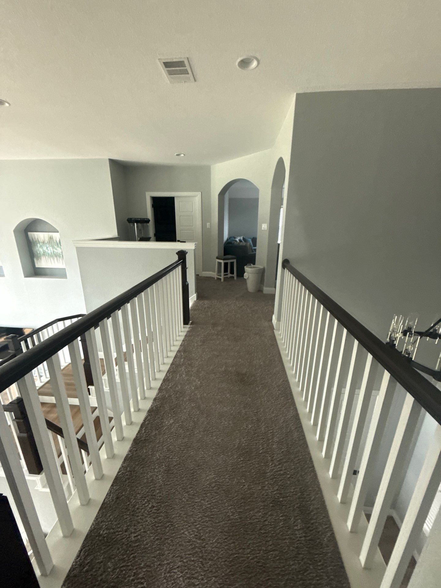 Upstairs hallway ahead of painting in Pflugerville, TX by Hill Country Painting