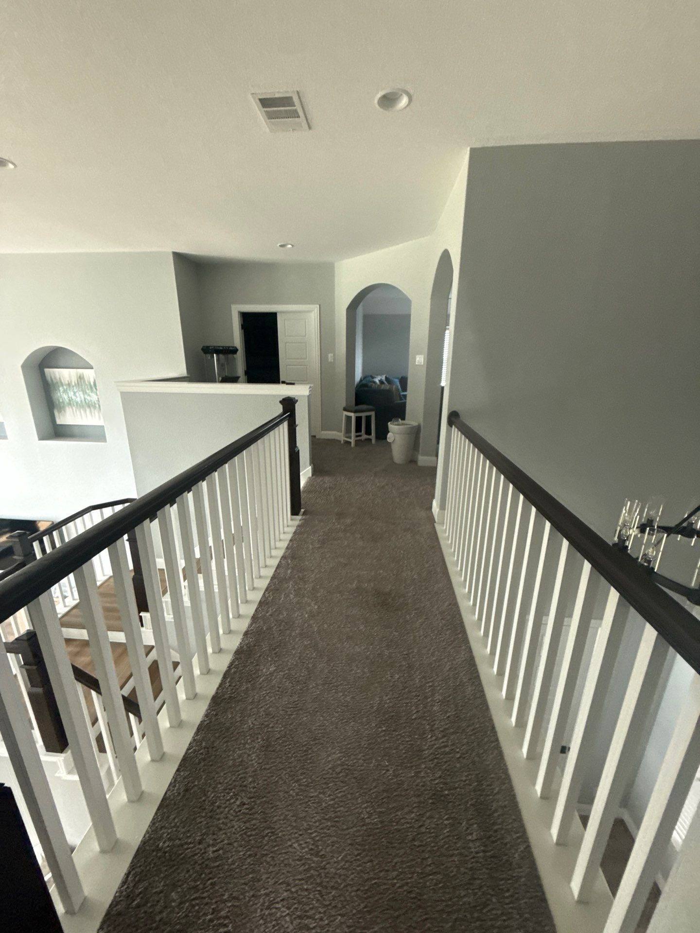 Upstairs hallway ahead of painting in Pflugerville, TX by Hill Country Painting