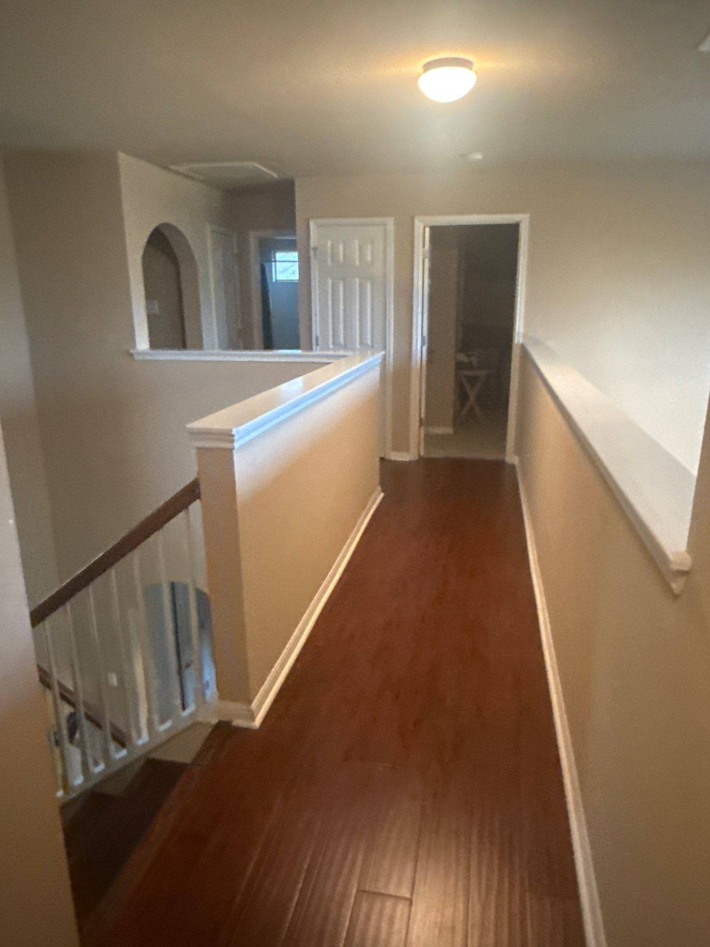 Upstairs hallway ahead of painting in Pflugerville, TX by Hill Country Painting