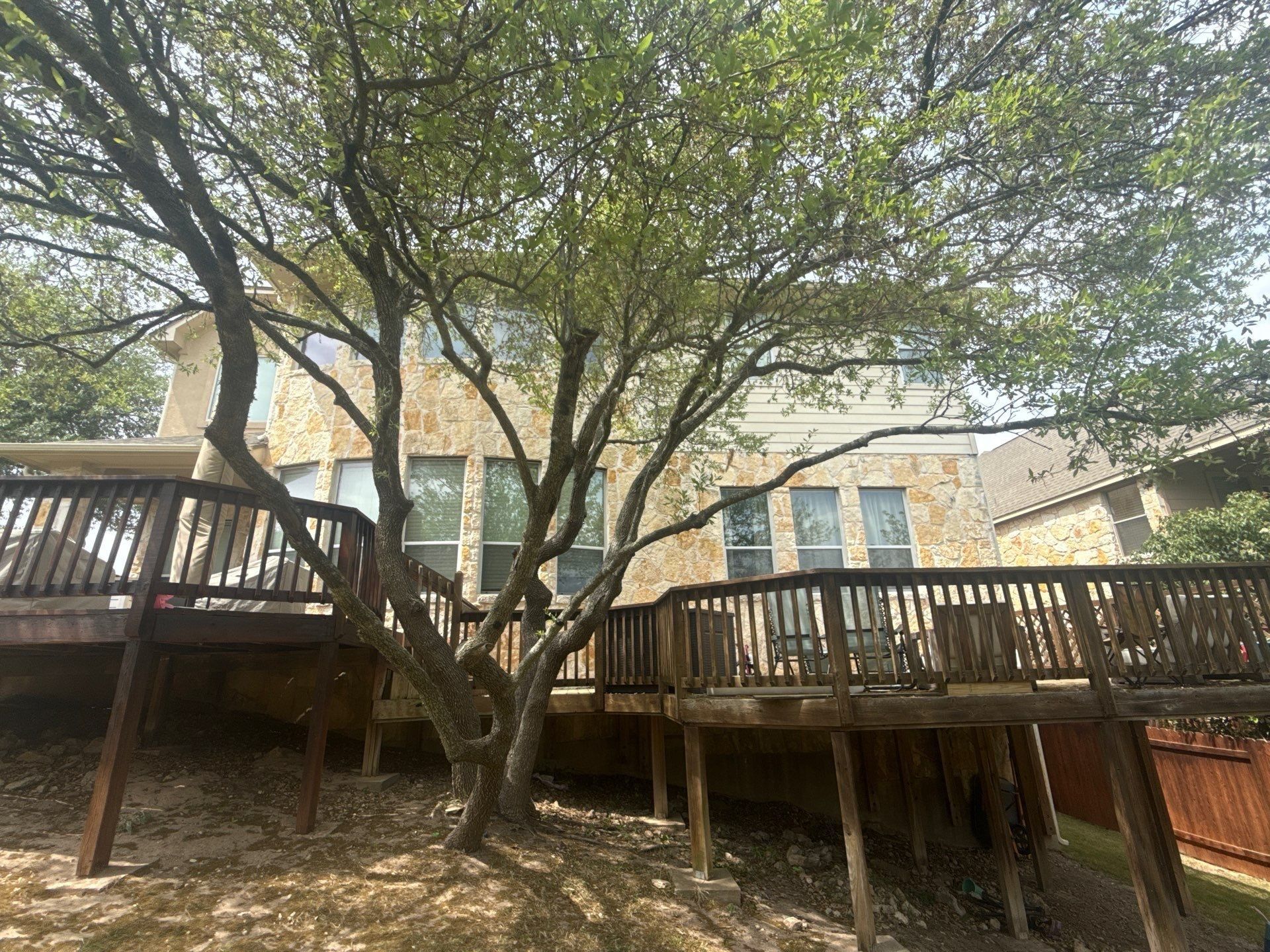 Back exterior and deck ahead of painting in Austin, TX by Hill Country Painting