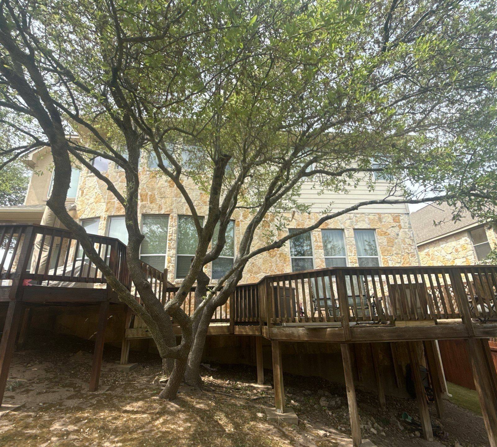 Back exterior and deck ahead of painting in Austin, TX by Hill Country Painting