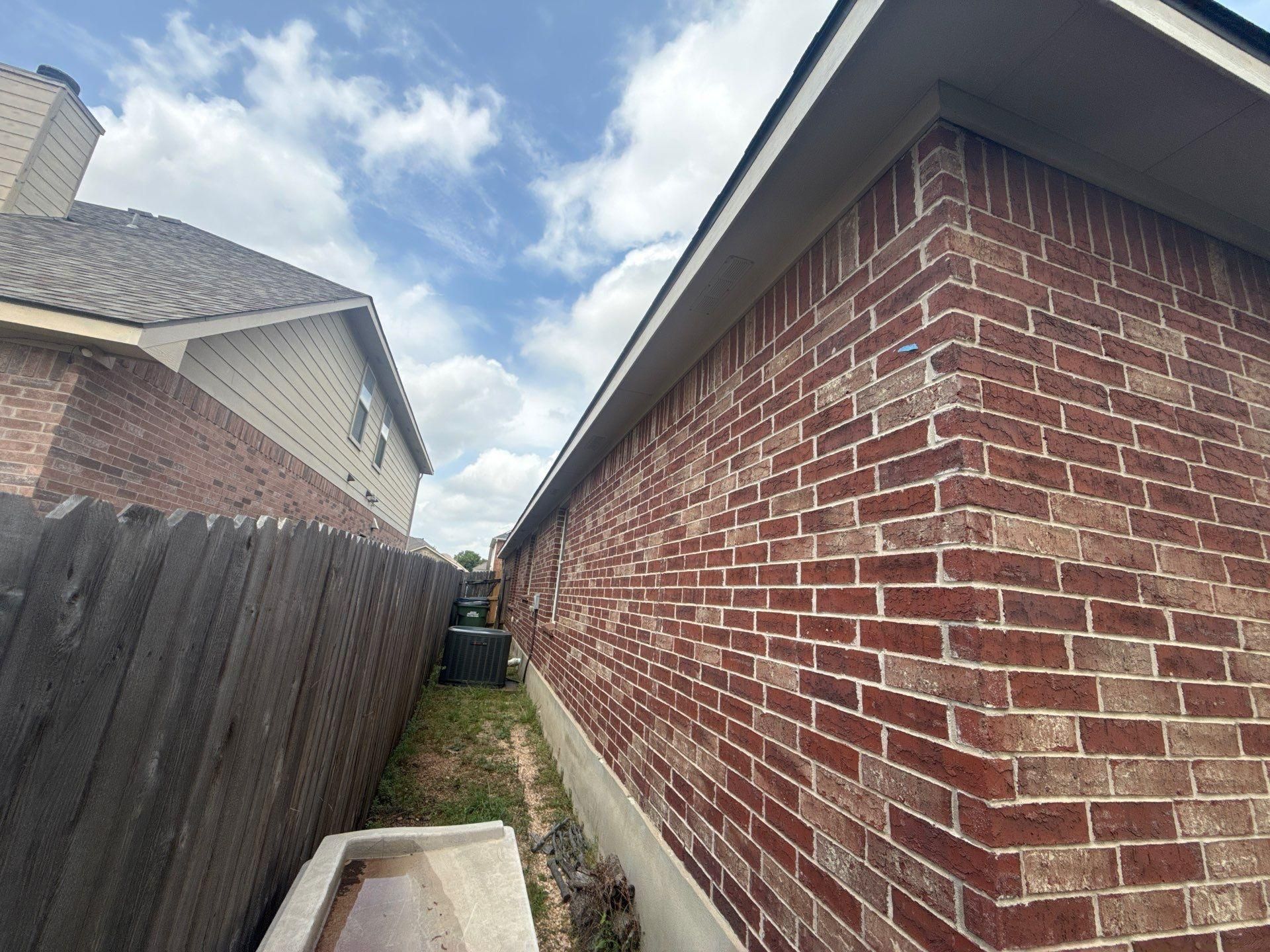 Brick exterior corner detail ahead of painting in Leander, TX by Hill Country Painting