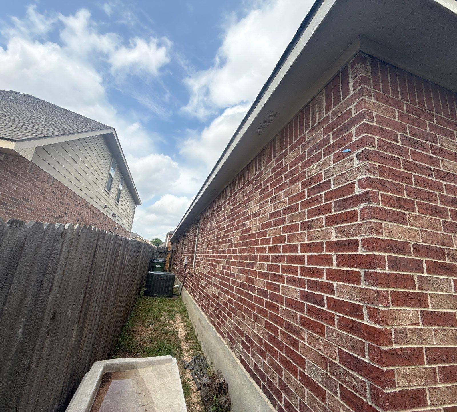 Brick exterior corner detail ahead of painting in Leander, TX by Hill Country Painting