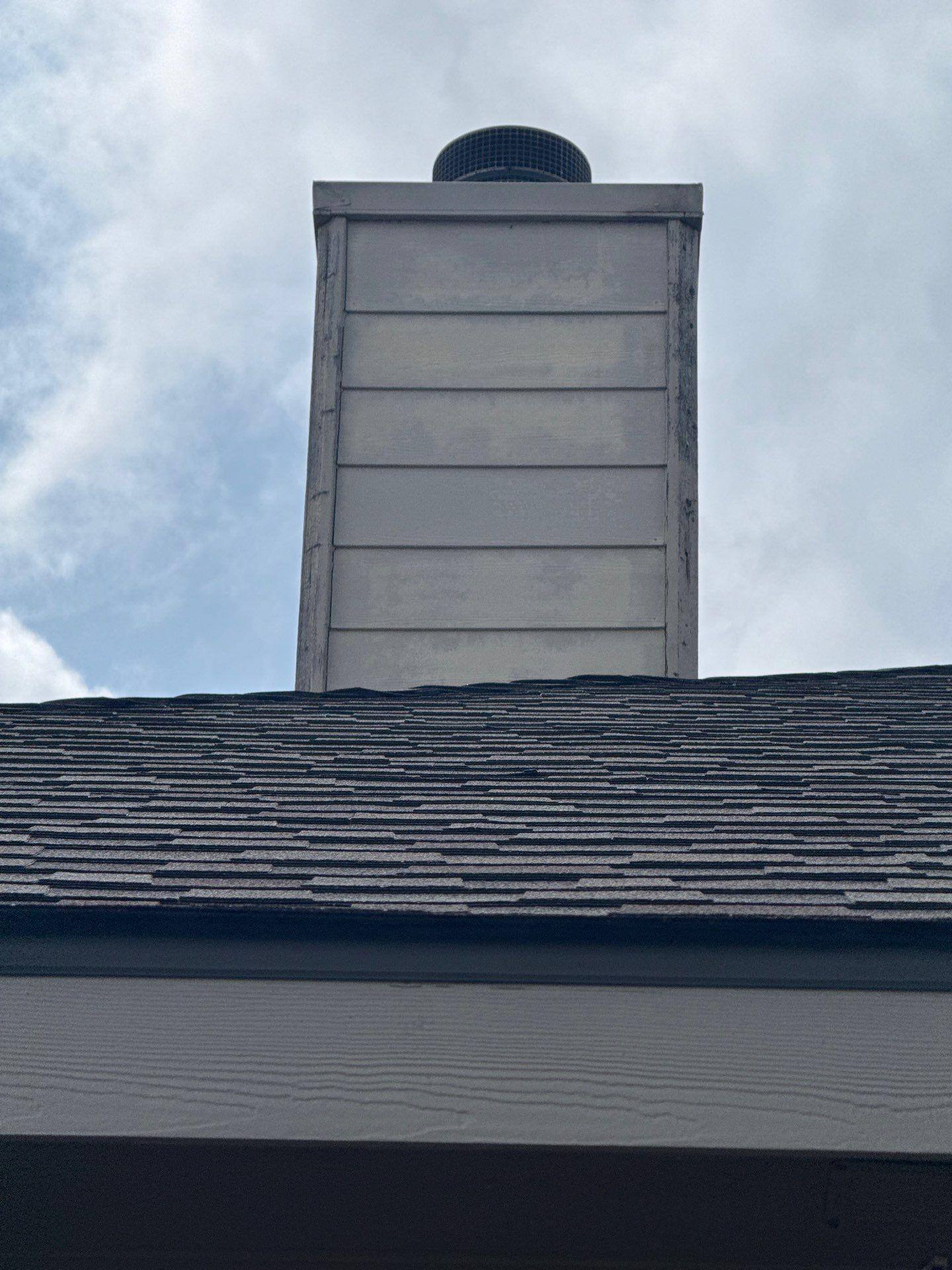 Chimney and roofline ahead of painting in Leander, TX by Hill Country Painting