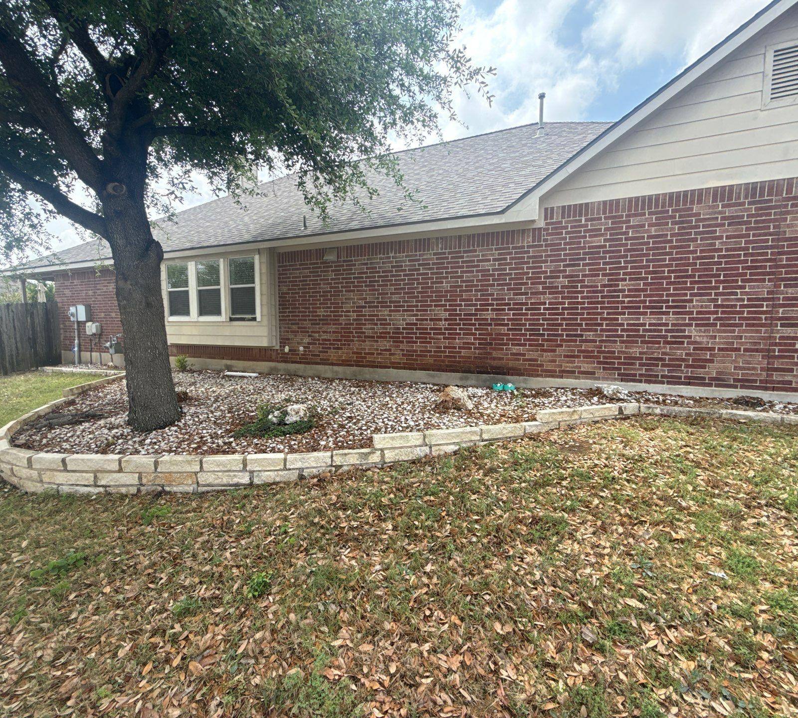 Side yard exterior view ahead of painting in Leander, TX by Hill Country Painting