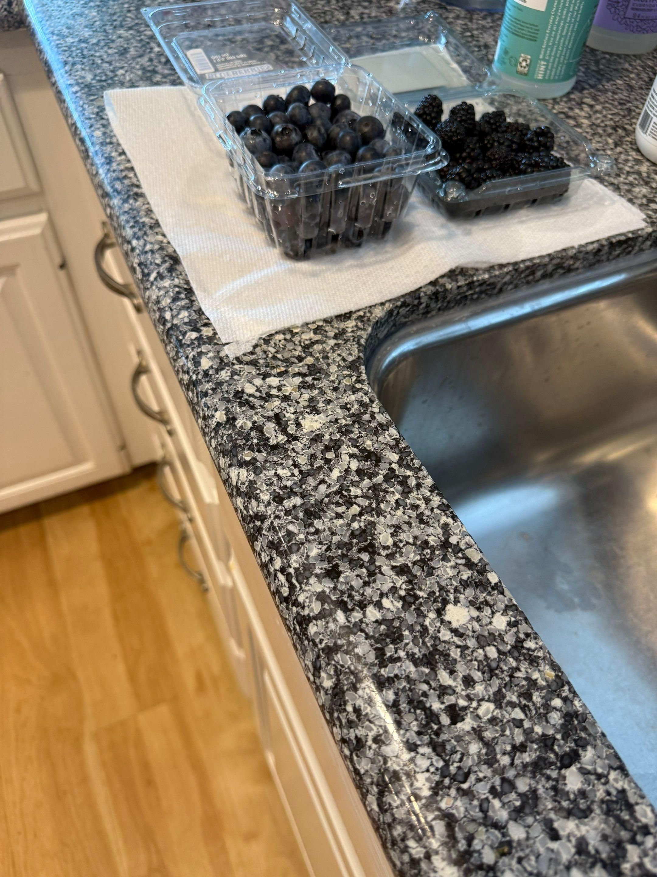 Kitchen sink and cabinet area ahead of refinishing in Georgetown, TX by Hill Country Painting