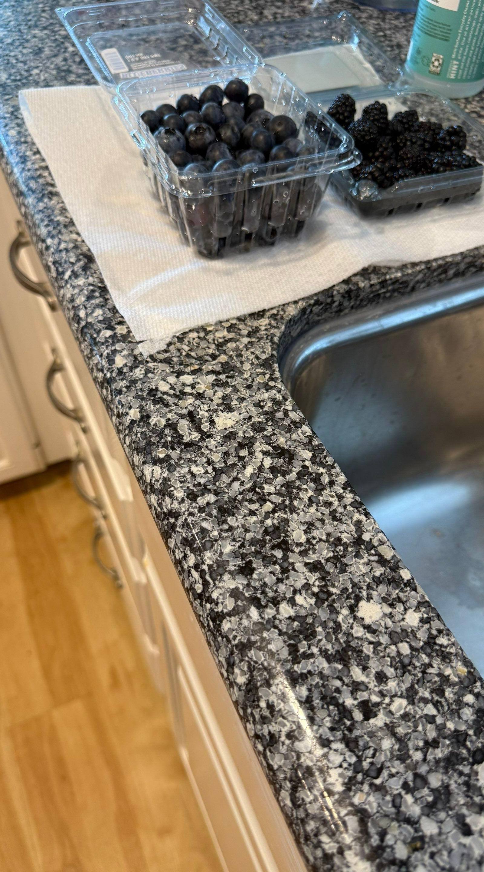 Kitchen sink and cabinet area ahead of refinishing in Georgetown, TX by Hill Country Painting