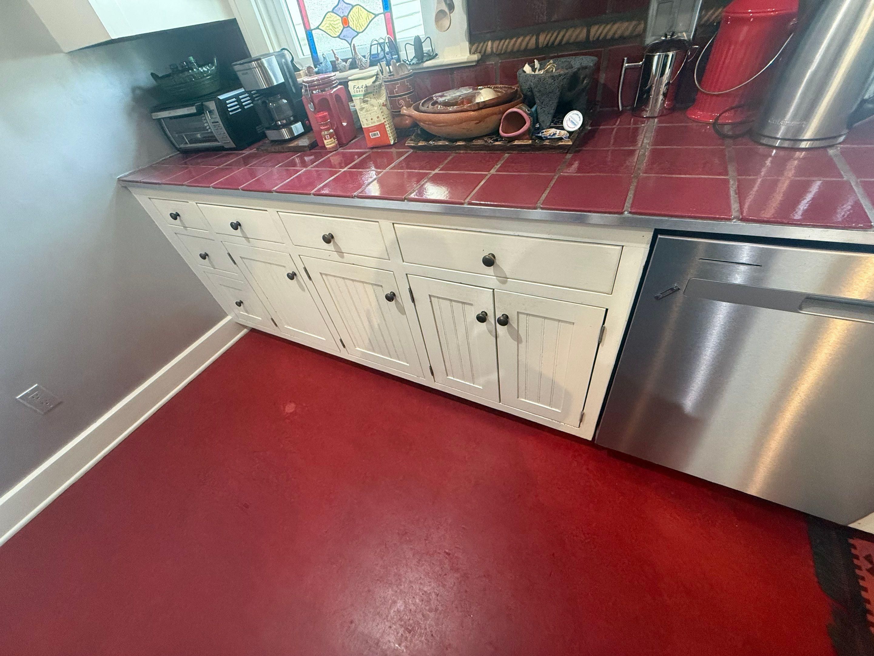 Kitchen cabinet run near appliances ahead of refinishing in Austin, TX by Hill Country Painting