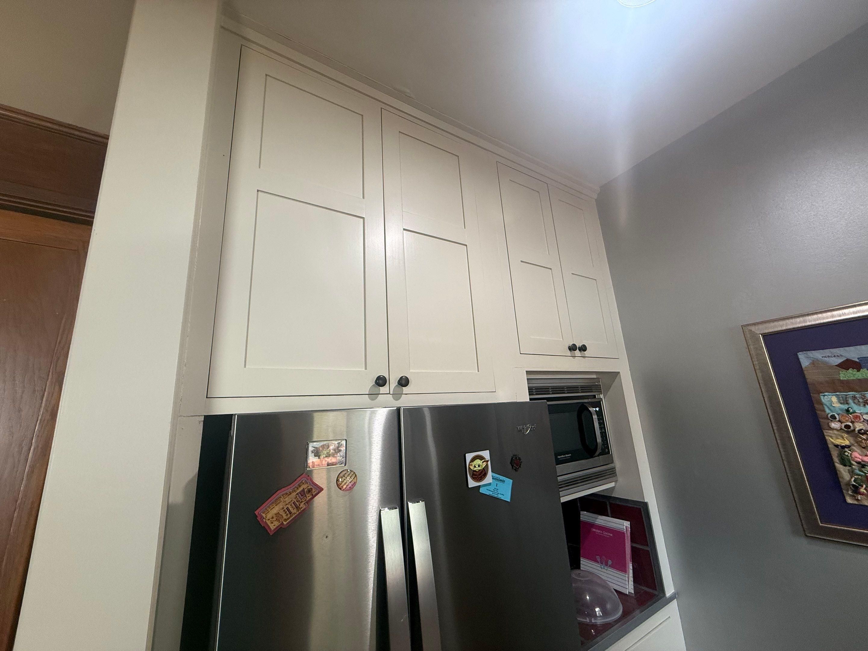 Upper kitchen cabinets ahead of refinishing in Austin, TX by Hill Country Painting