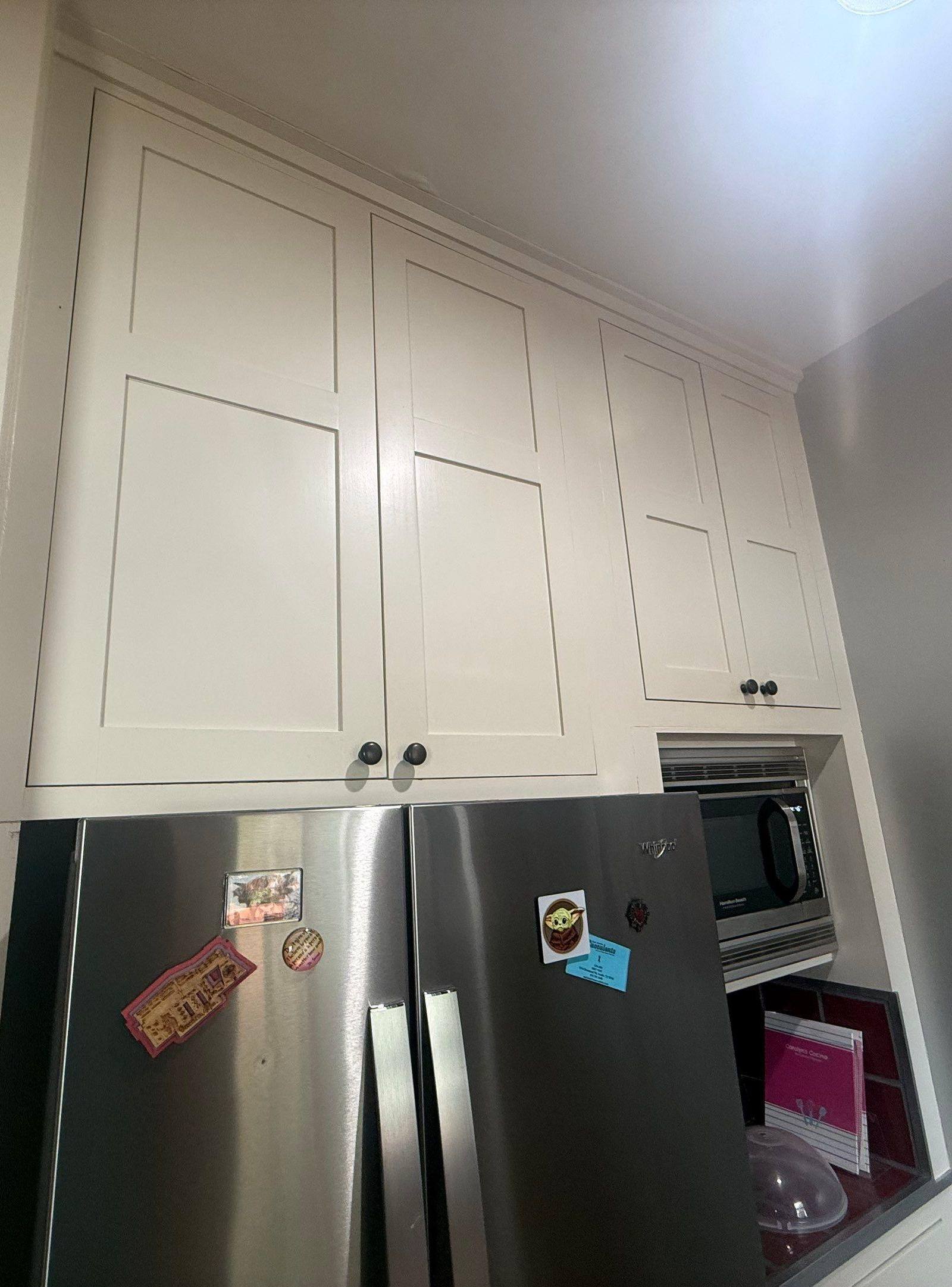 Upper kitchen cabinets ahead of refinishing in Austin, TX by Hill Country Painting