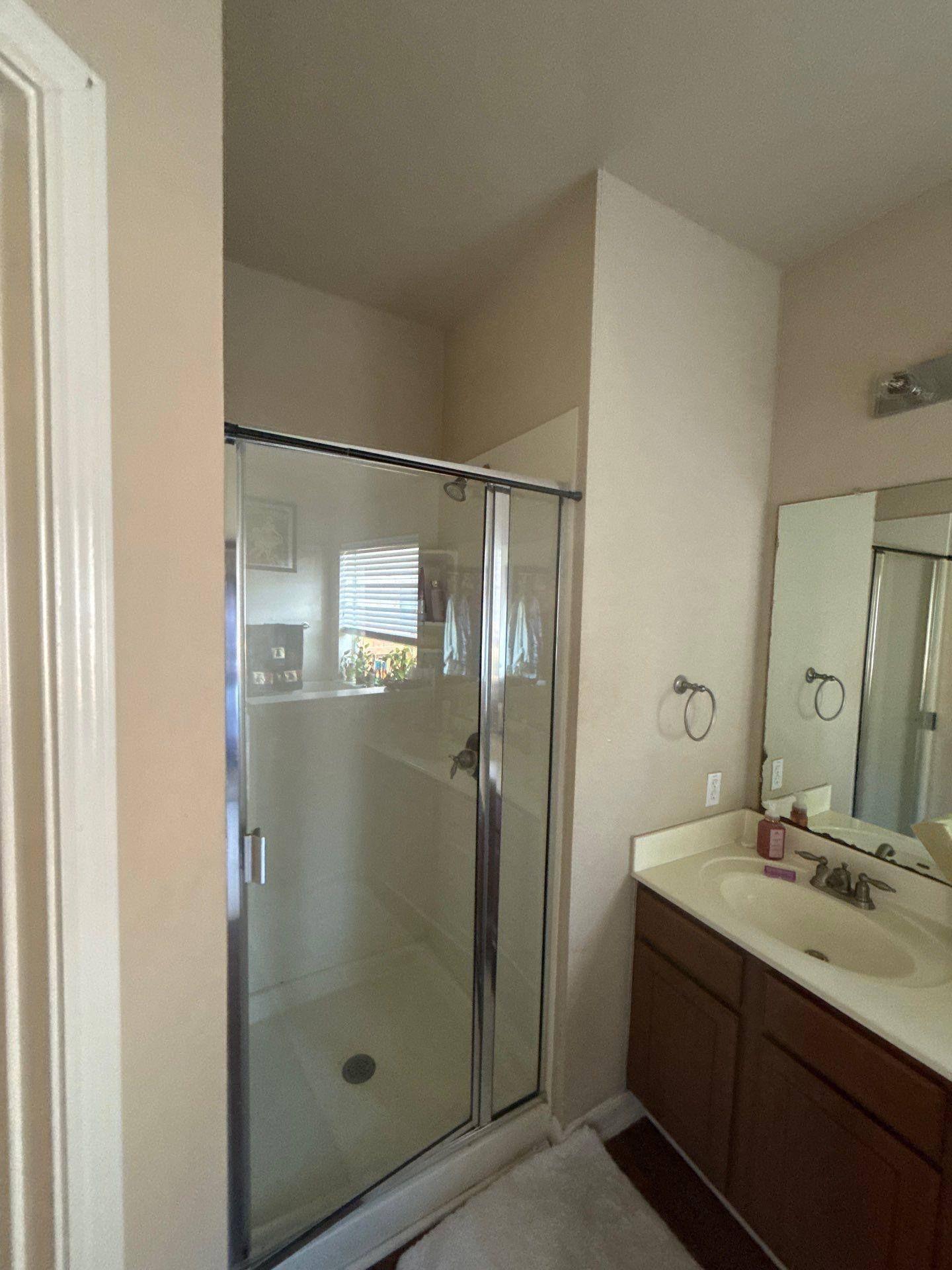 Bathroom vanity and cabinets ahead of painting and cabinet refinishing in Austin, TX by Hill Country Painting