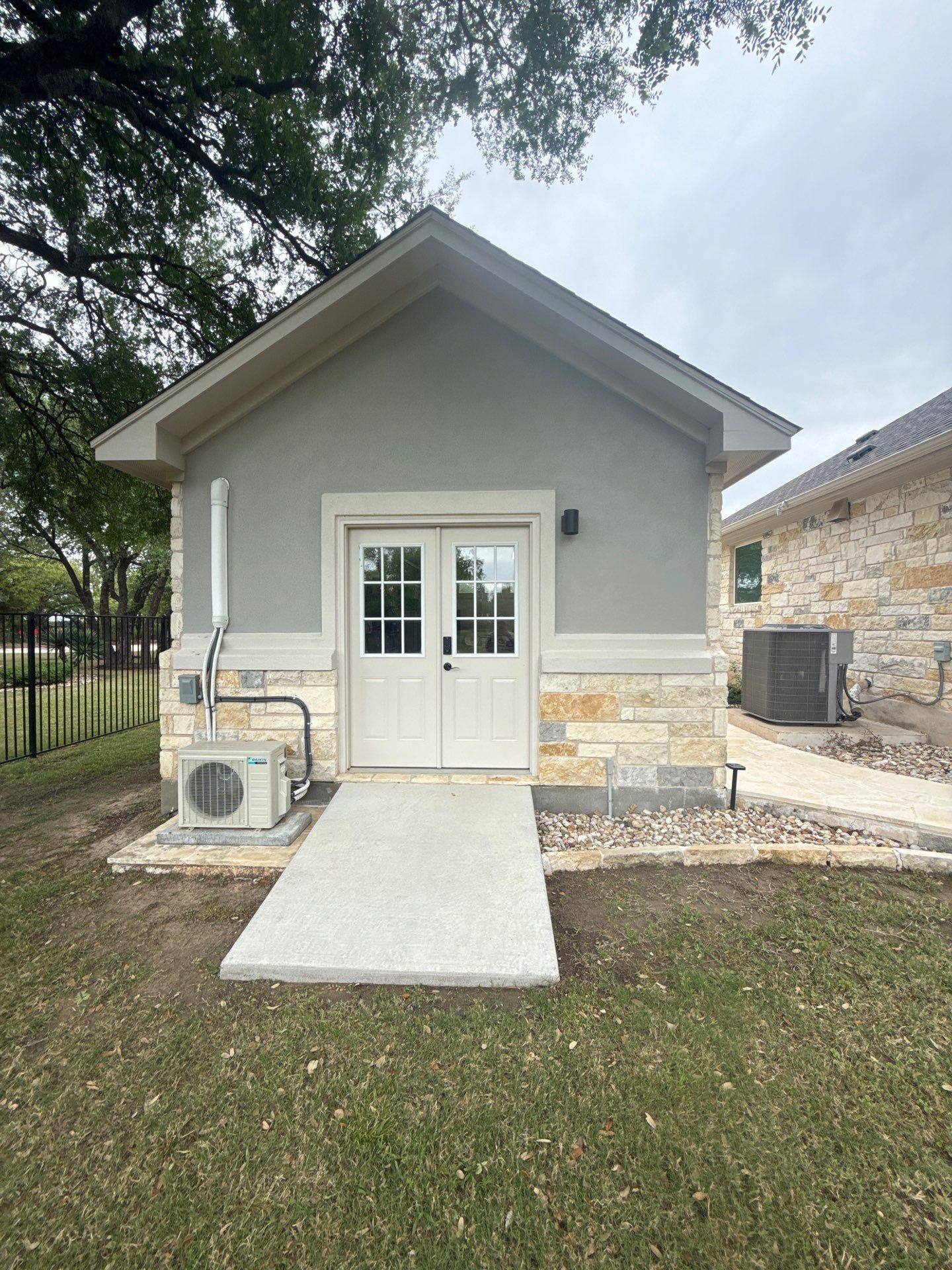 Separate garage building ahead of exterior painting in Leander, TX by Hill Country Painting