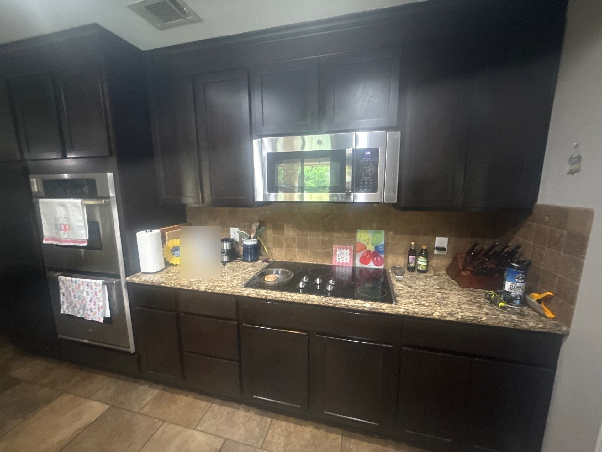Kitchen cabinets ahead of cabinet painting in Round Rock, TX by Hill Country Painting