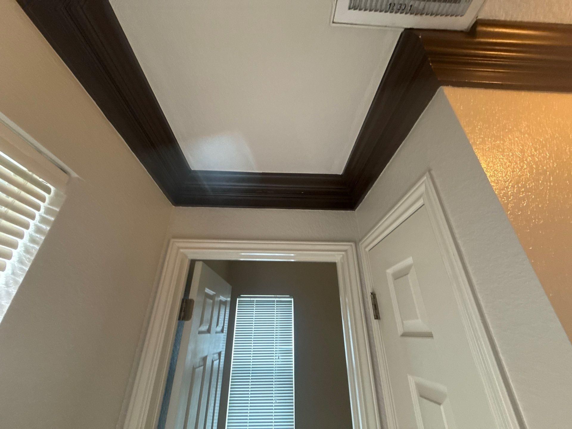 Hallway crown molding detail ahead of painting in Austin, TX by Hill Country Painting