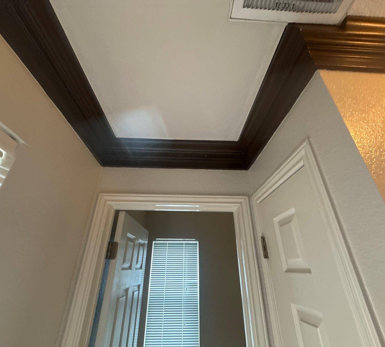 Hallway crown molding detail ahead of painting in Austin, TX by Hill Country Painting
