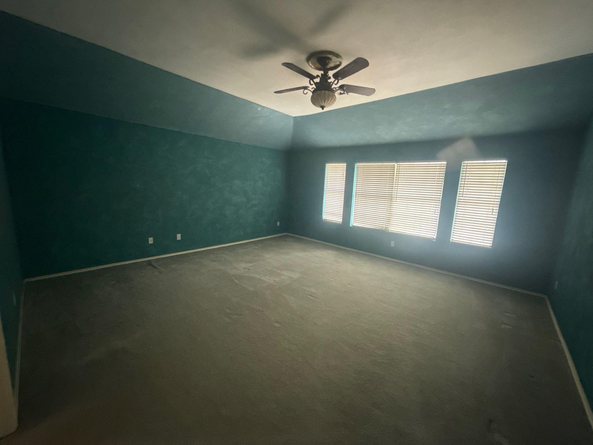 Bedroom with accent wall ahead of interior painting in Round Rock, TX by Hill Country Painting