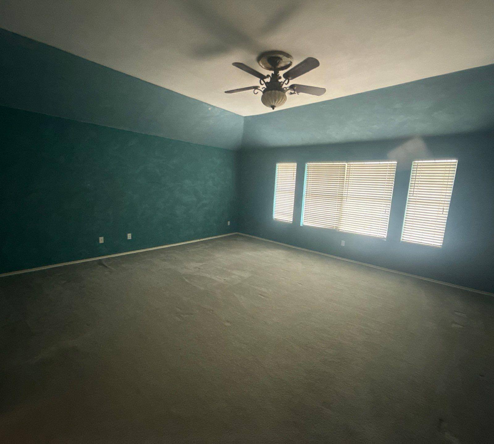 Bedroom with accent wall ahead of interior painting in Round Rock, TX by Hill Country Painting