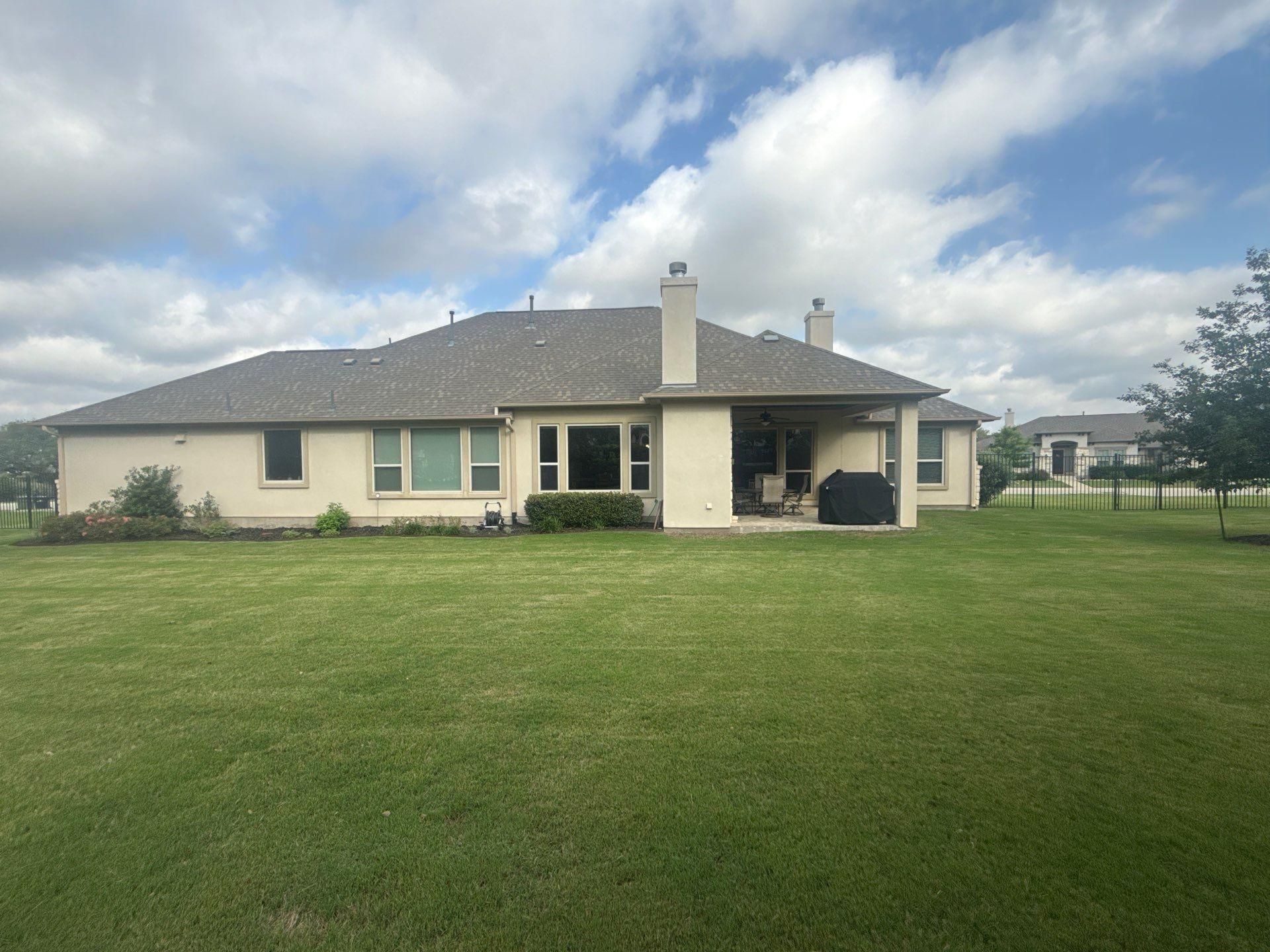 Back elevation and covered patio ahead of exterior painting in Liberty Hill, TX by Hill Country Painting