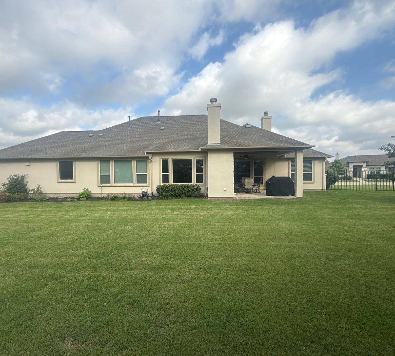 Back elevation and covered patio ahead of exterior painting in Liberty Hill, TX by Hill Country Painting