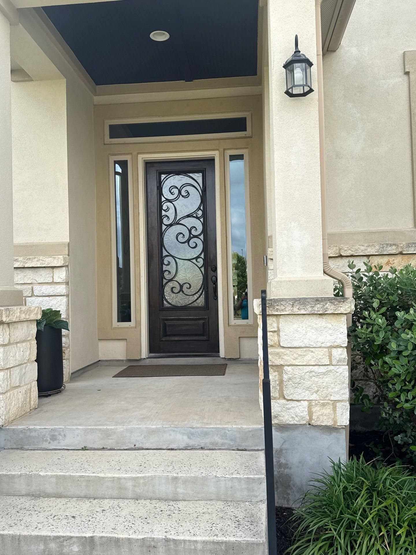 Front entry door ahead of exterior painting in Liberty Hill, TX by Hill Country Painting