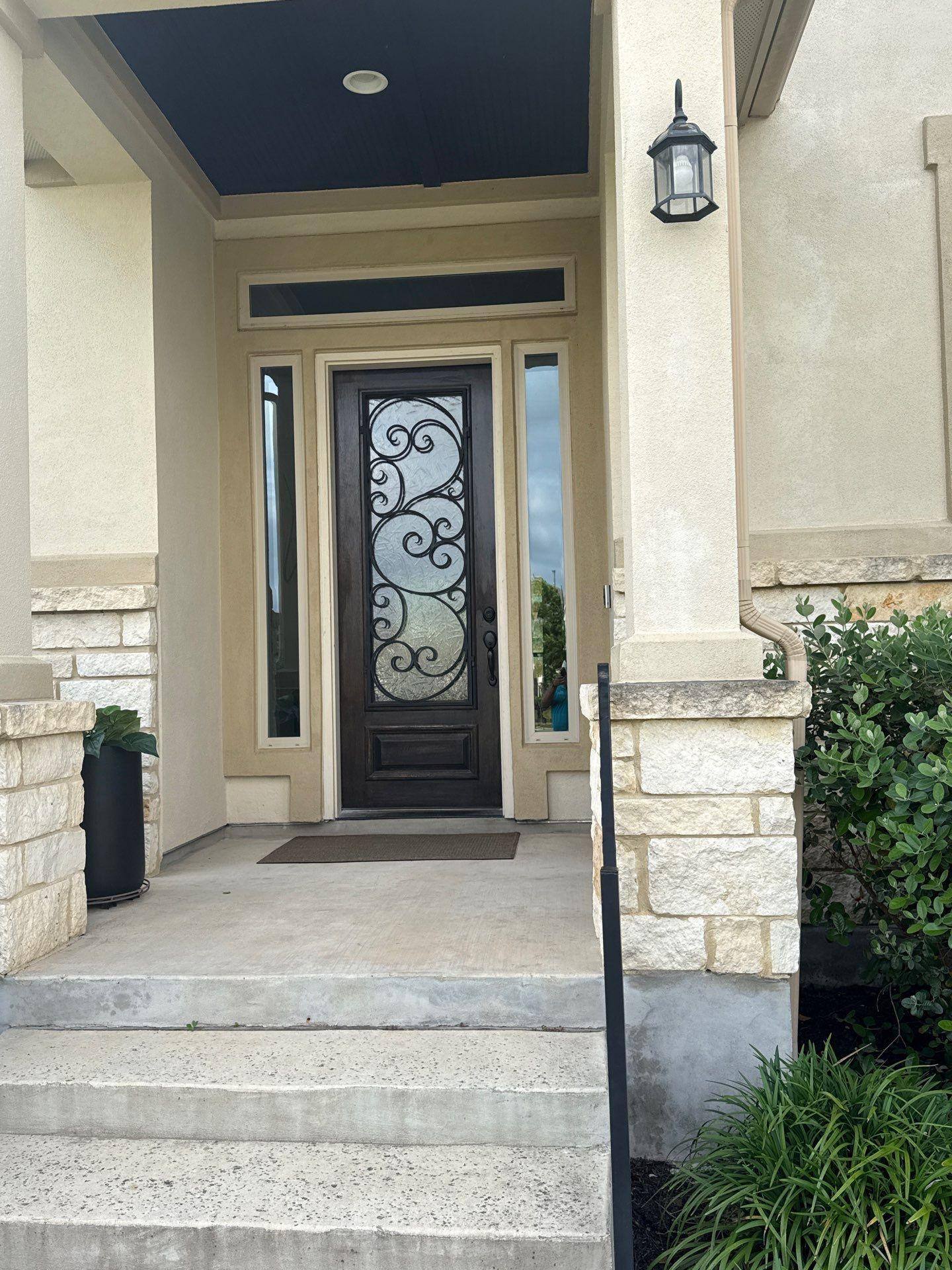 Front entry door ahead of exterior painting in Liberty Hill, TX by Hill Country Painting