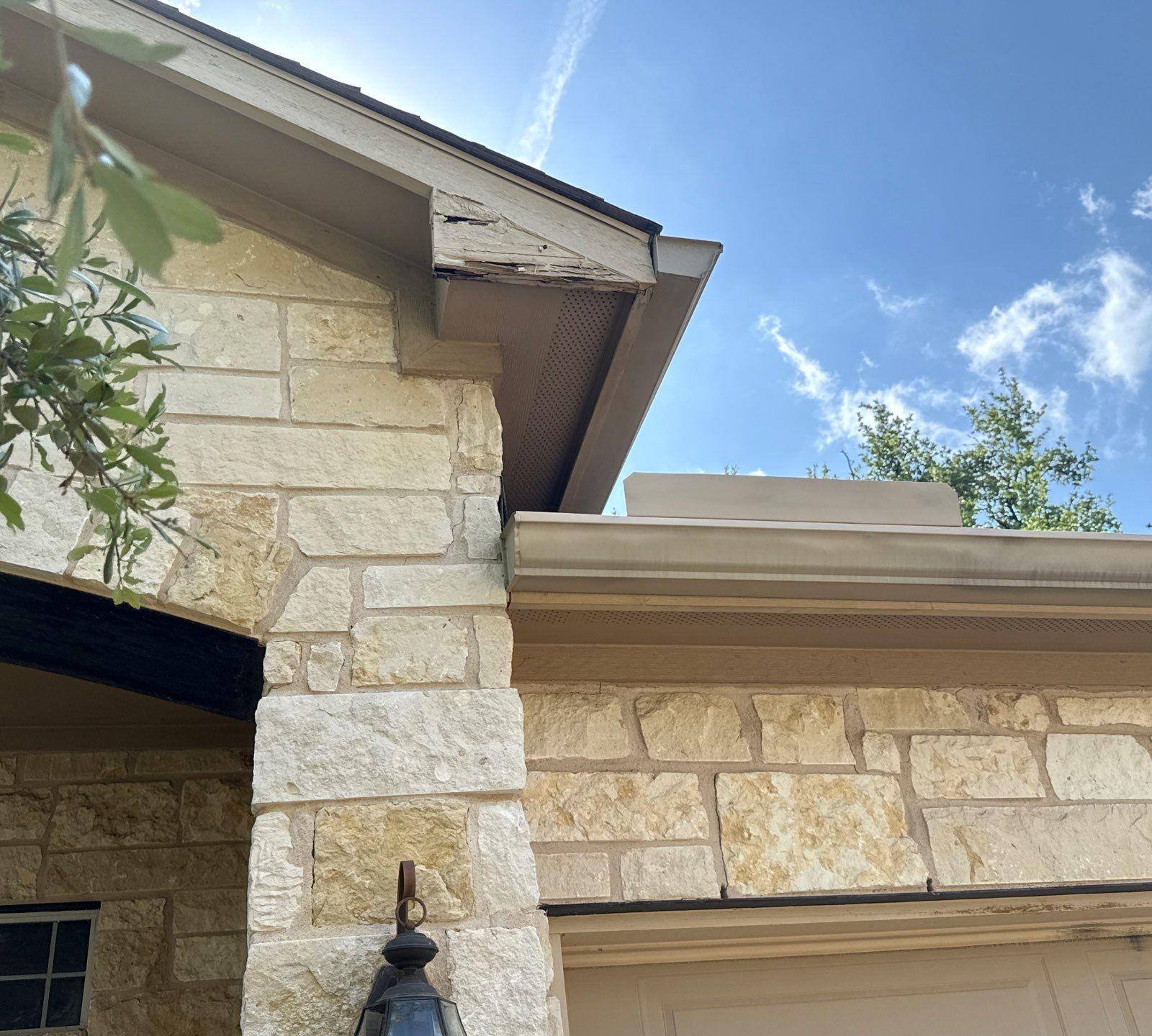 Front porch stone column and soffit detail ahead of exterior painting in Cedar Park, TX by Hill Country Painting