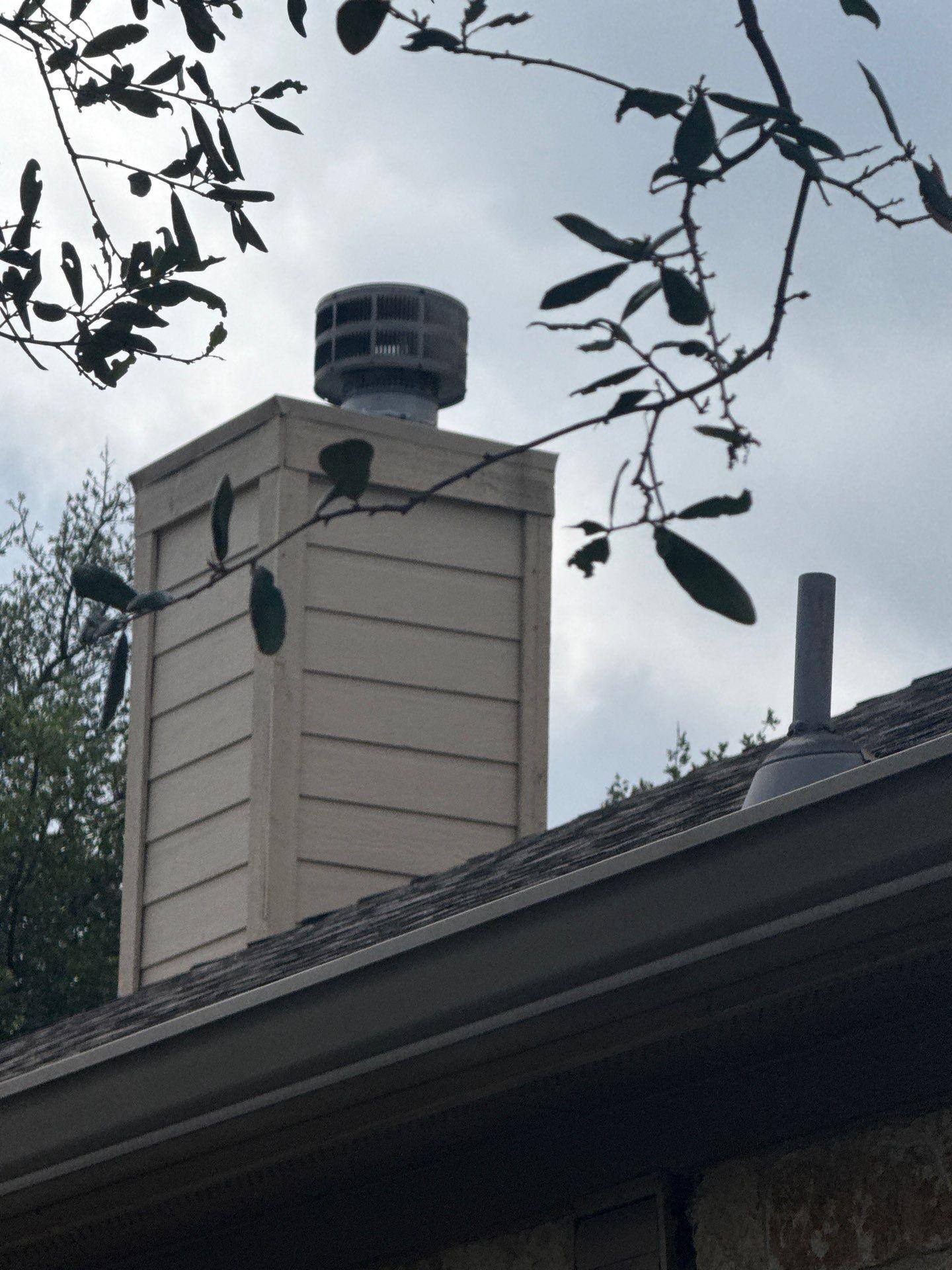 Chimney and roofline ahead of exterior painting in Cedar Park, TX by Hill Country Painting