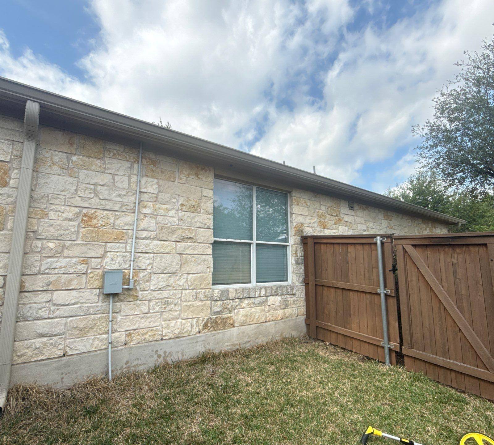 Side yard elevation ahead of exterior painting in Cedar Park, TX by Hill Country Painting