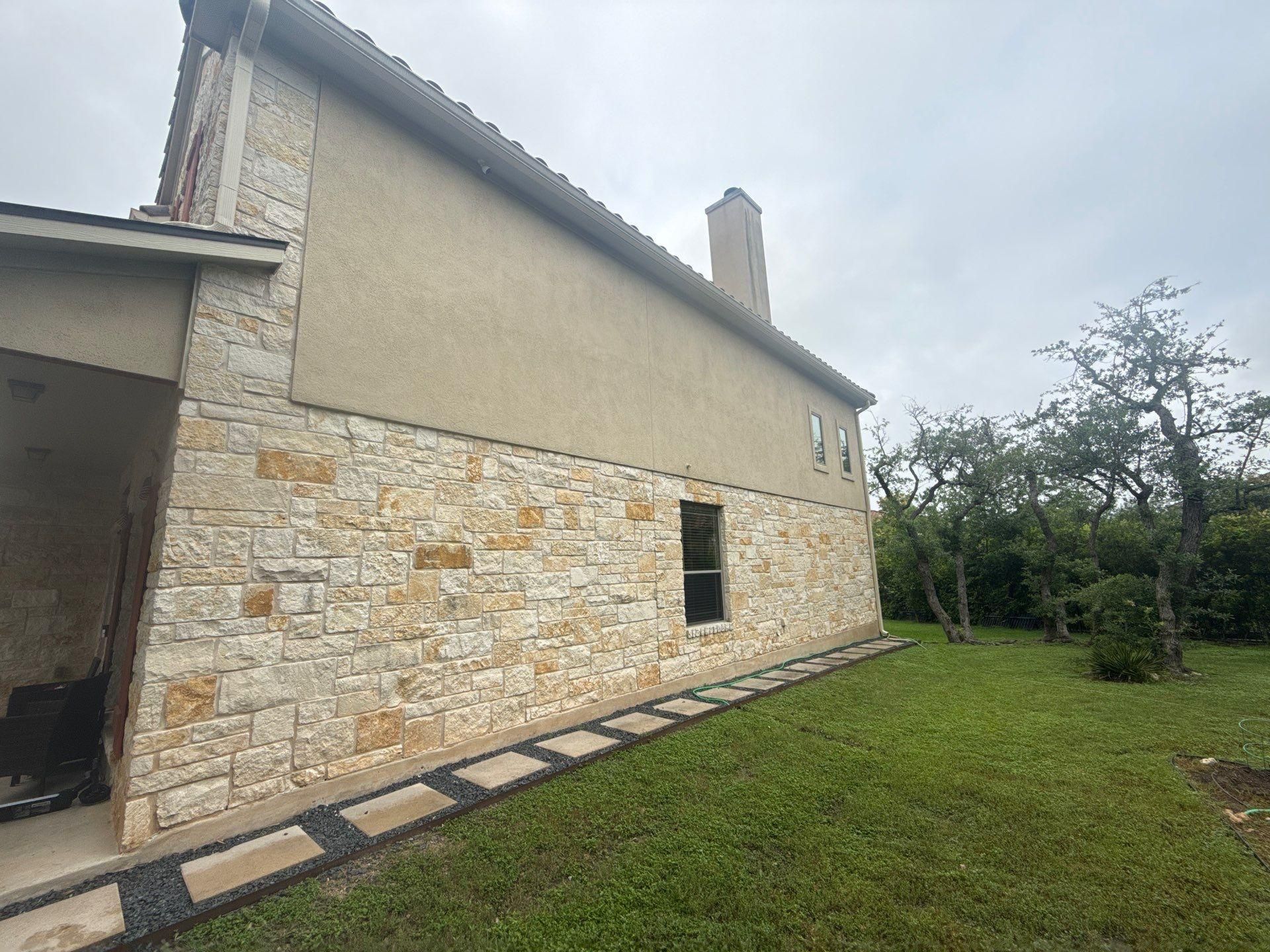 Right side elevation and chimney at a home in Bee Cave, TX visited by Hill Country Painting