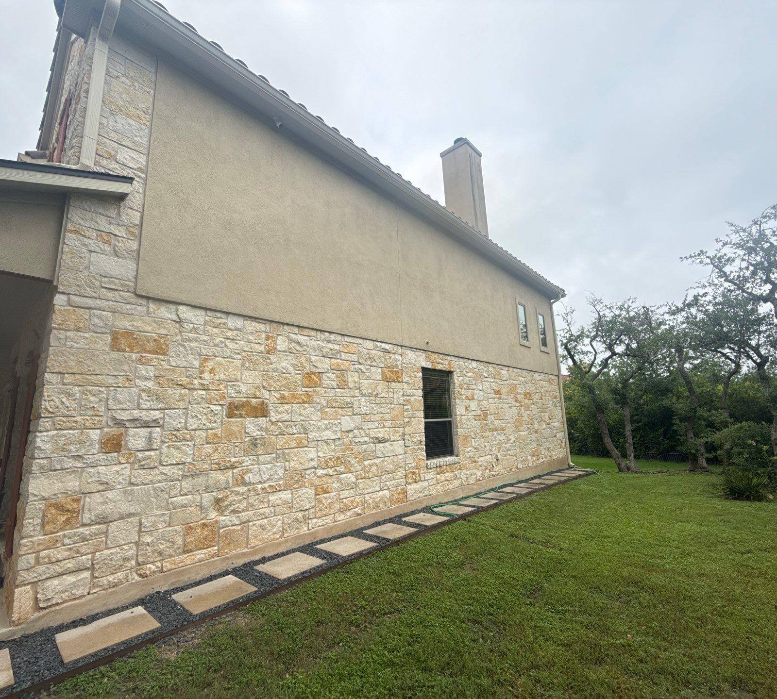 Right side elevation and chimney at a home in Bee Cave, TX visited by Hill Country Painting