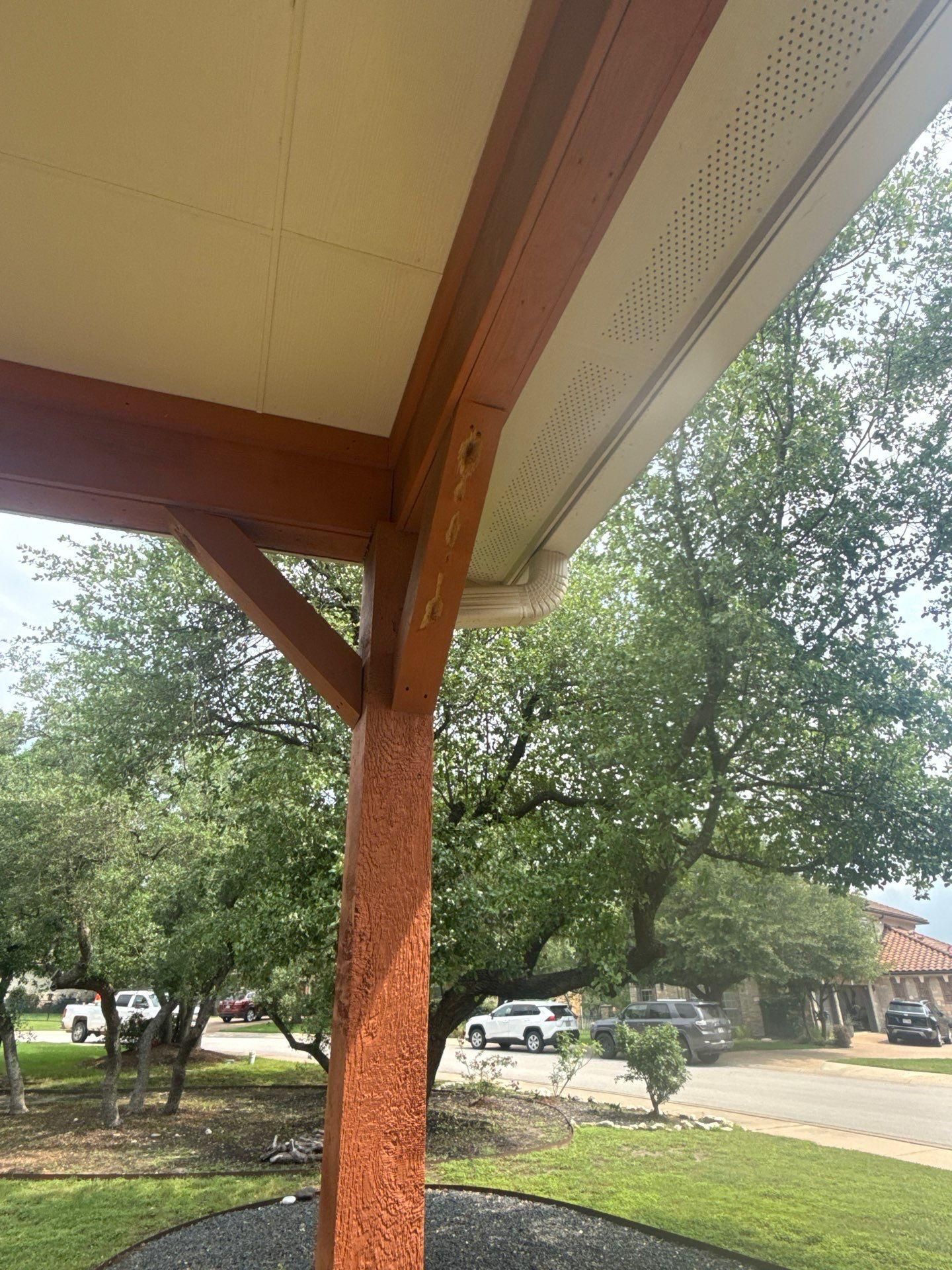 Covered porch beam detail at a home in Bee Cave, TX ahead of exterior painting by Hill Country Painting