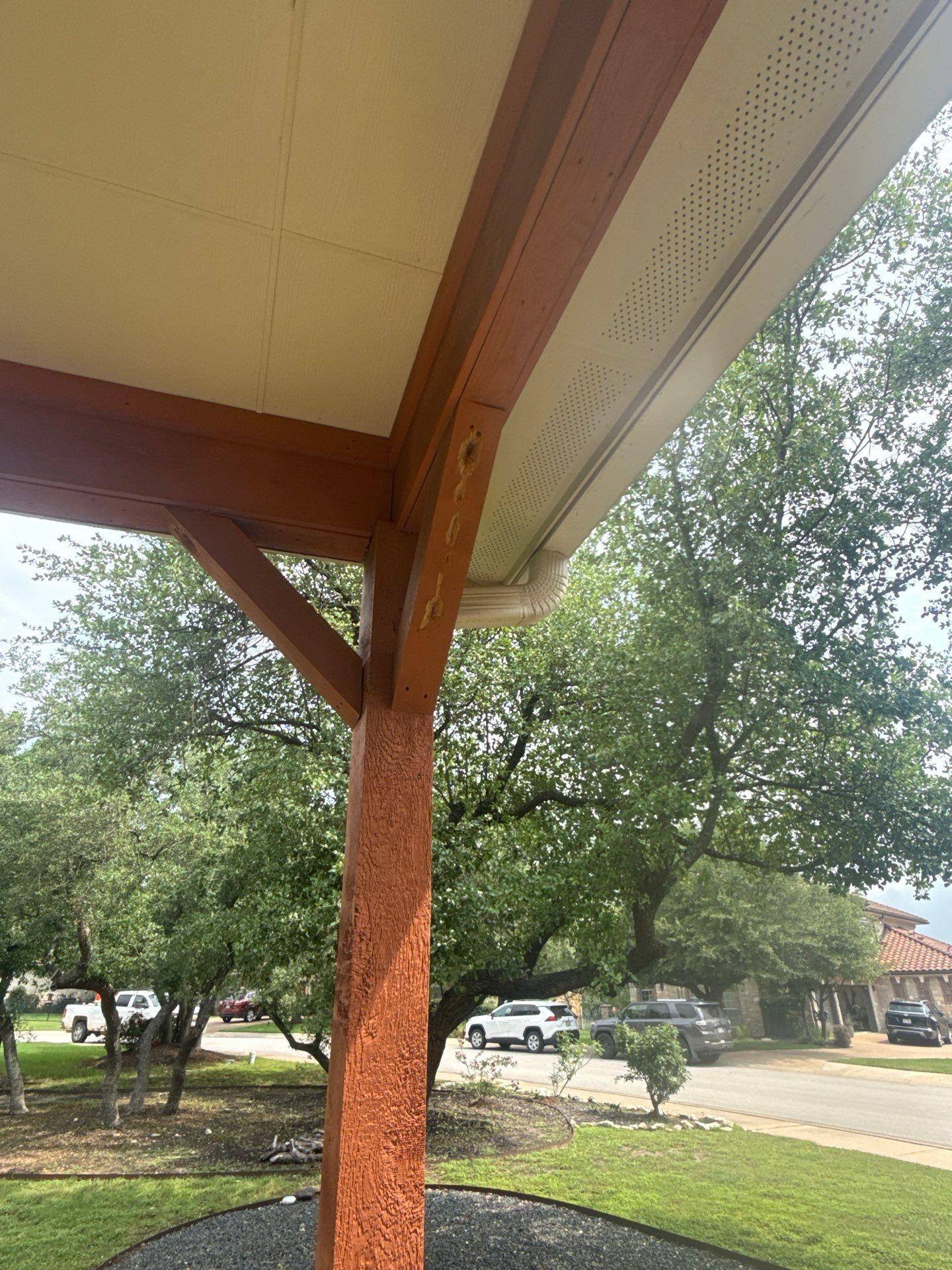 Covered porch beam detail at a home in Bee Cave, TX ahead of exterior painting by Hill Country Painting