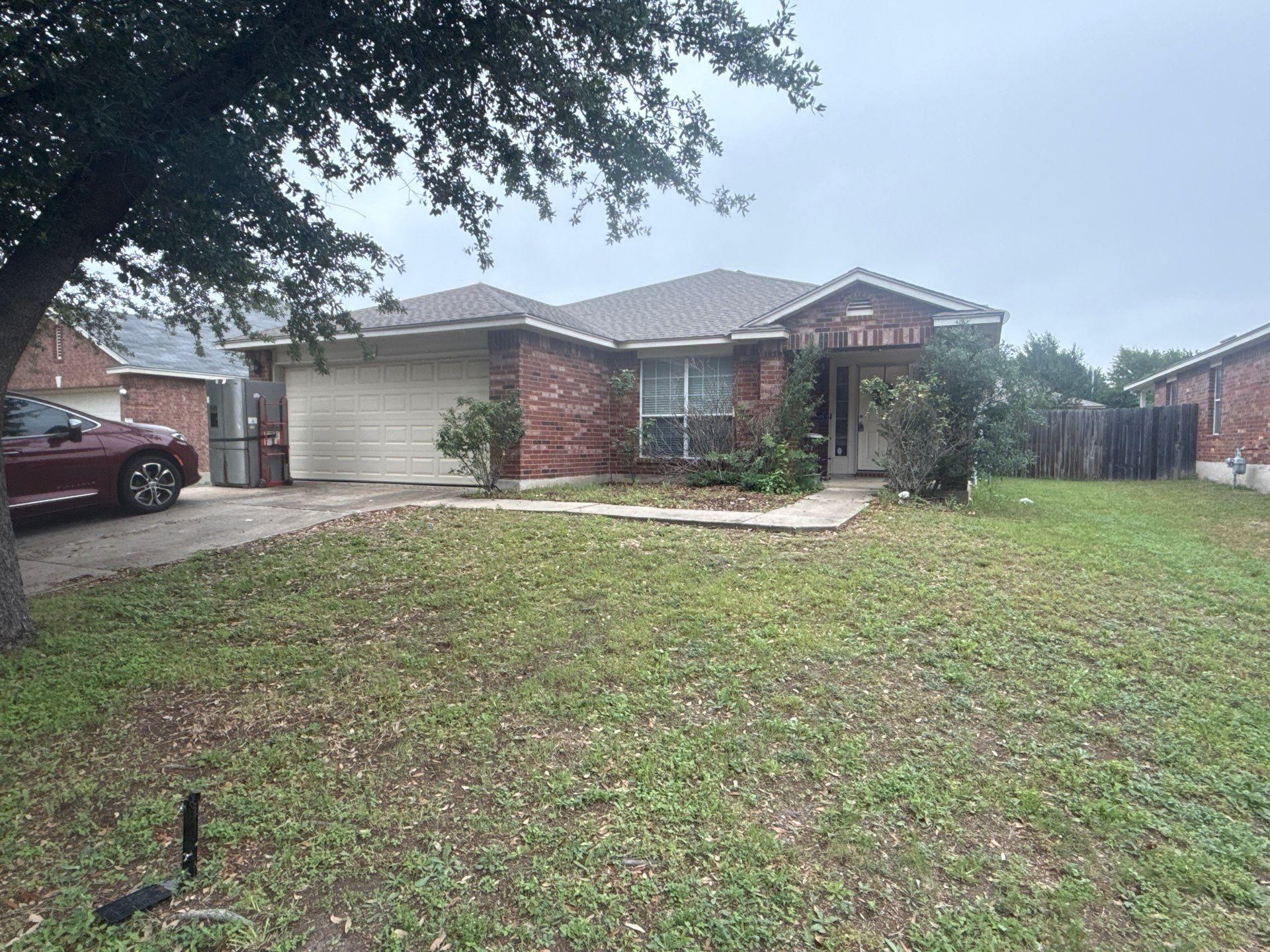 Front elevation of a home in Round Rock, TX ahead of interior painting by Hill Country Painting