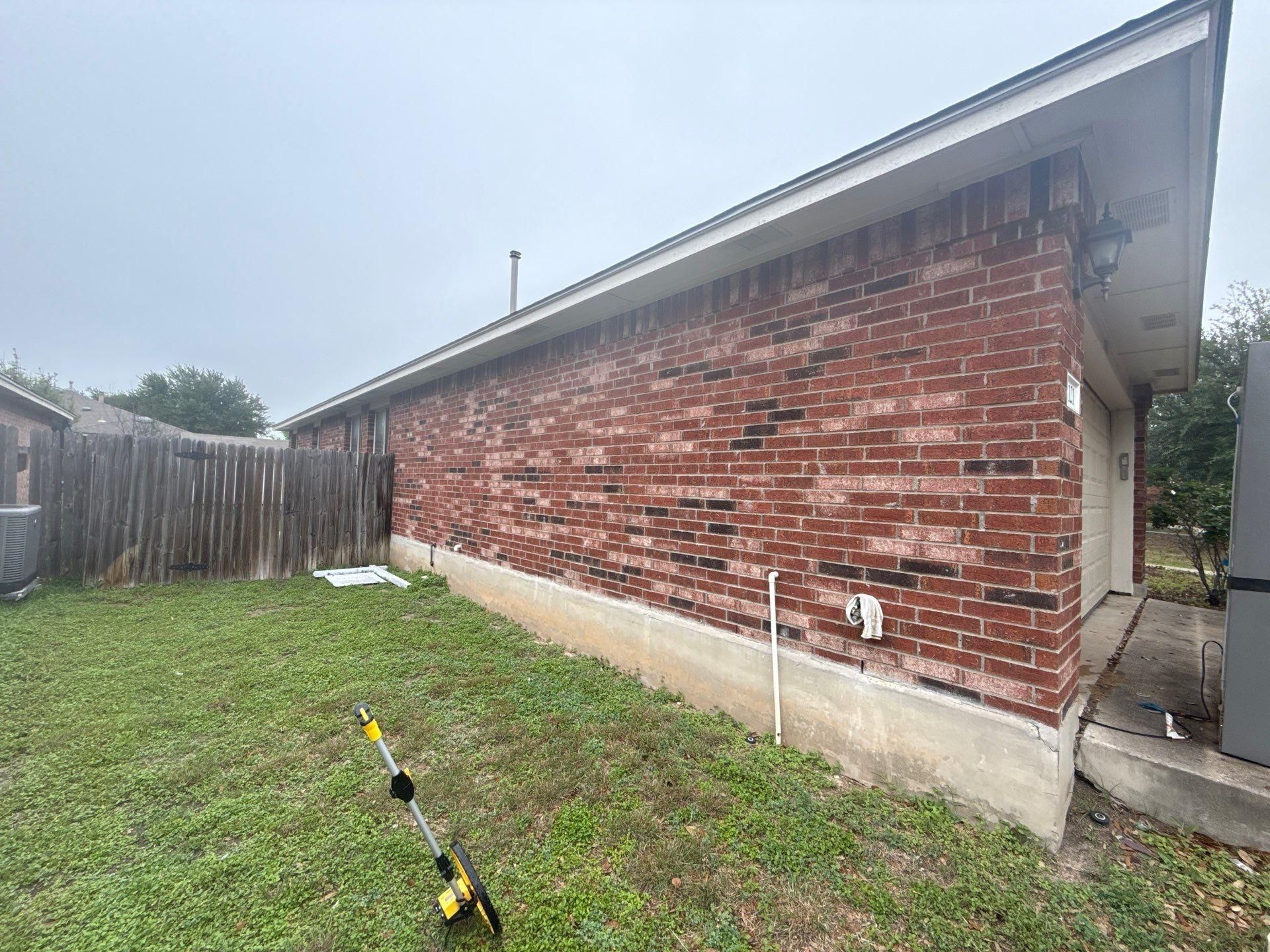 Side elevation of a home in Round Rock, TX visited by Hill Country Painting