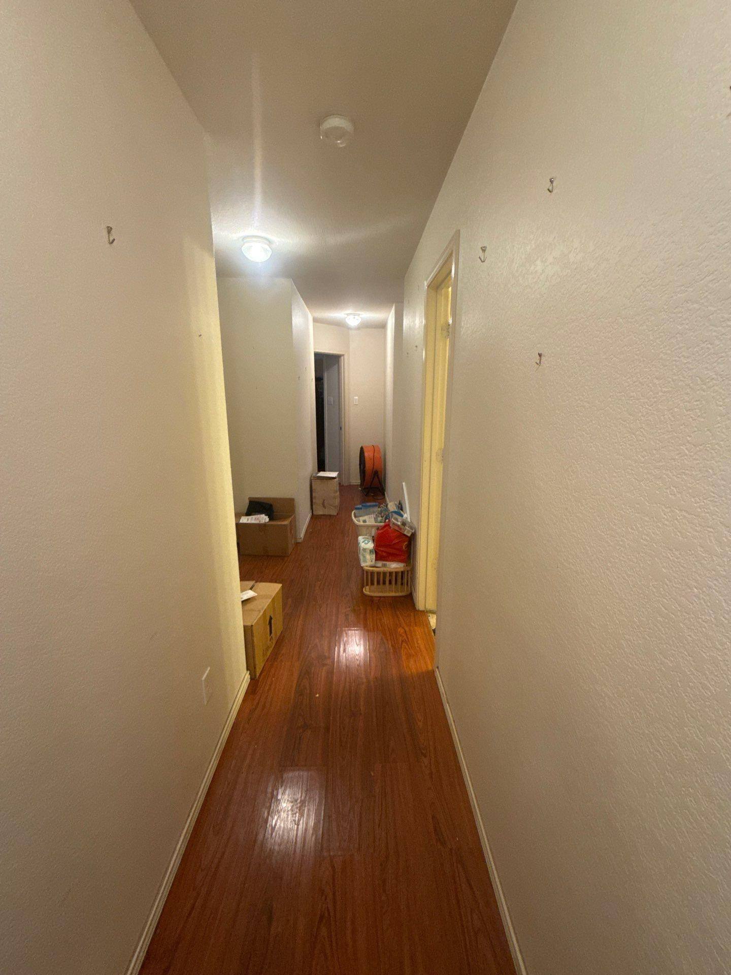 Interior hallway ahead of painting at a home in Round Rock, TX by Hill Country Painting