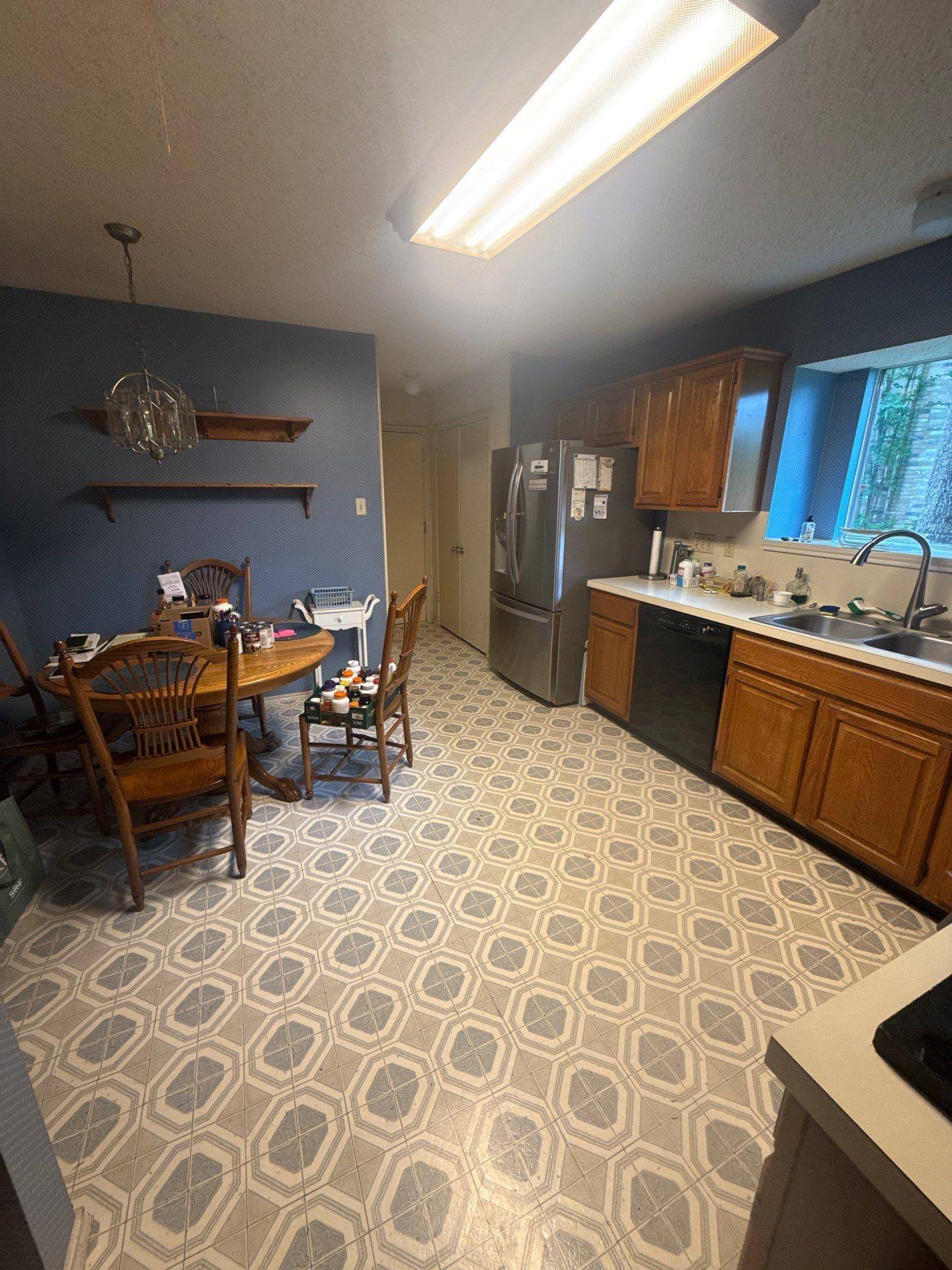 Kitchen and dining area of a home in Pflugerville, TX ahead of interior painting by Hill Country Painting