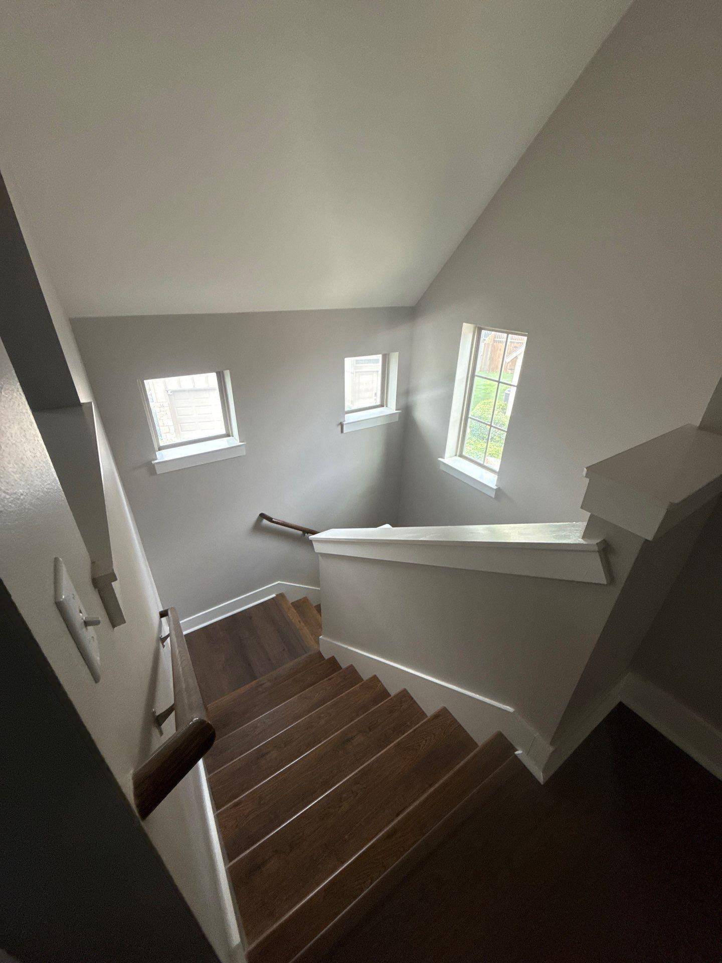 Stairwell of a home in Austin, TX ahead of interior painting by Hill Country Painting