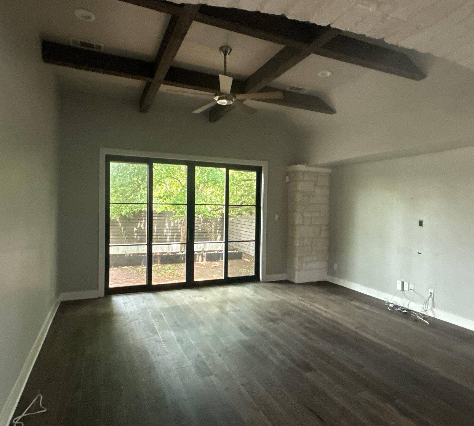 Living room of a home in Austin, TX ahead of interior painting by Hill Country Painting