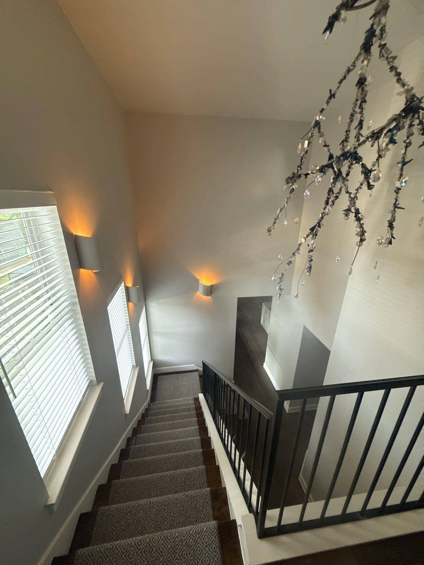 Stairwell of a home in Austin, TX ahead of interior painting by Hill Country Painting