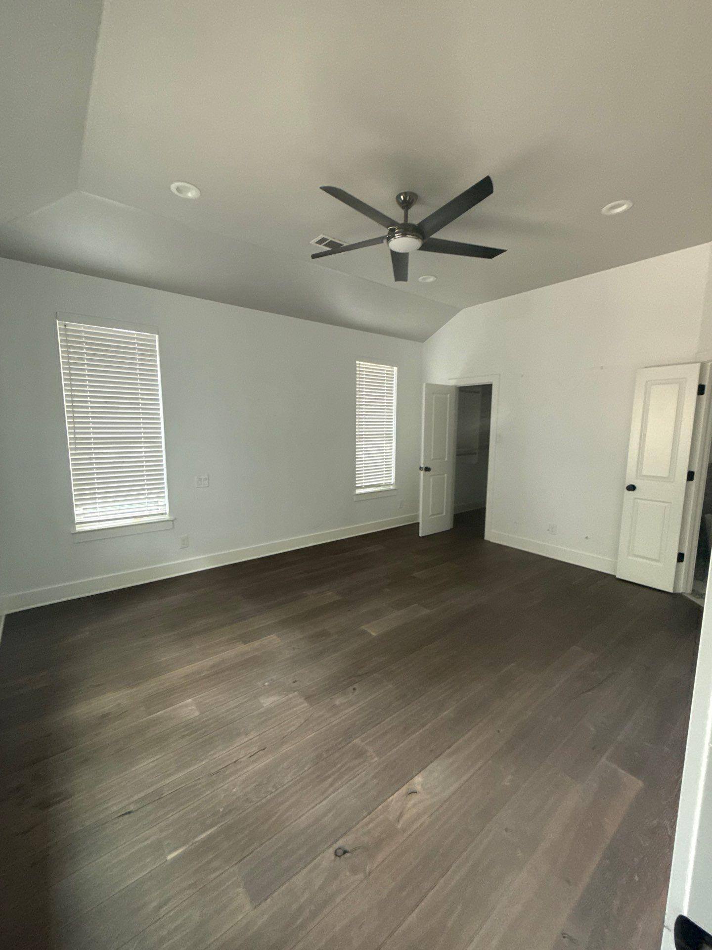 Master bedroom of a home in Austin, TX ahead of interior painting by Hill Country Painting