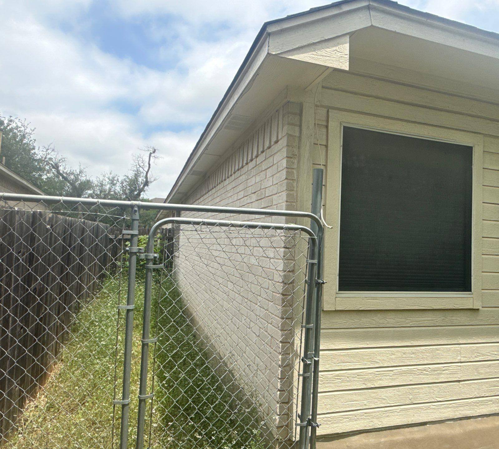 Exterior siding of a home in Austin, TX ahead of exterior painting by Hill Country Painting