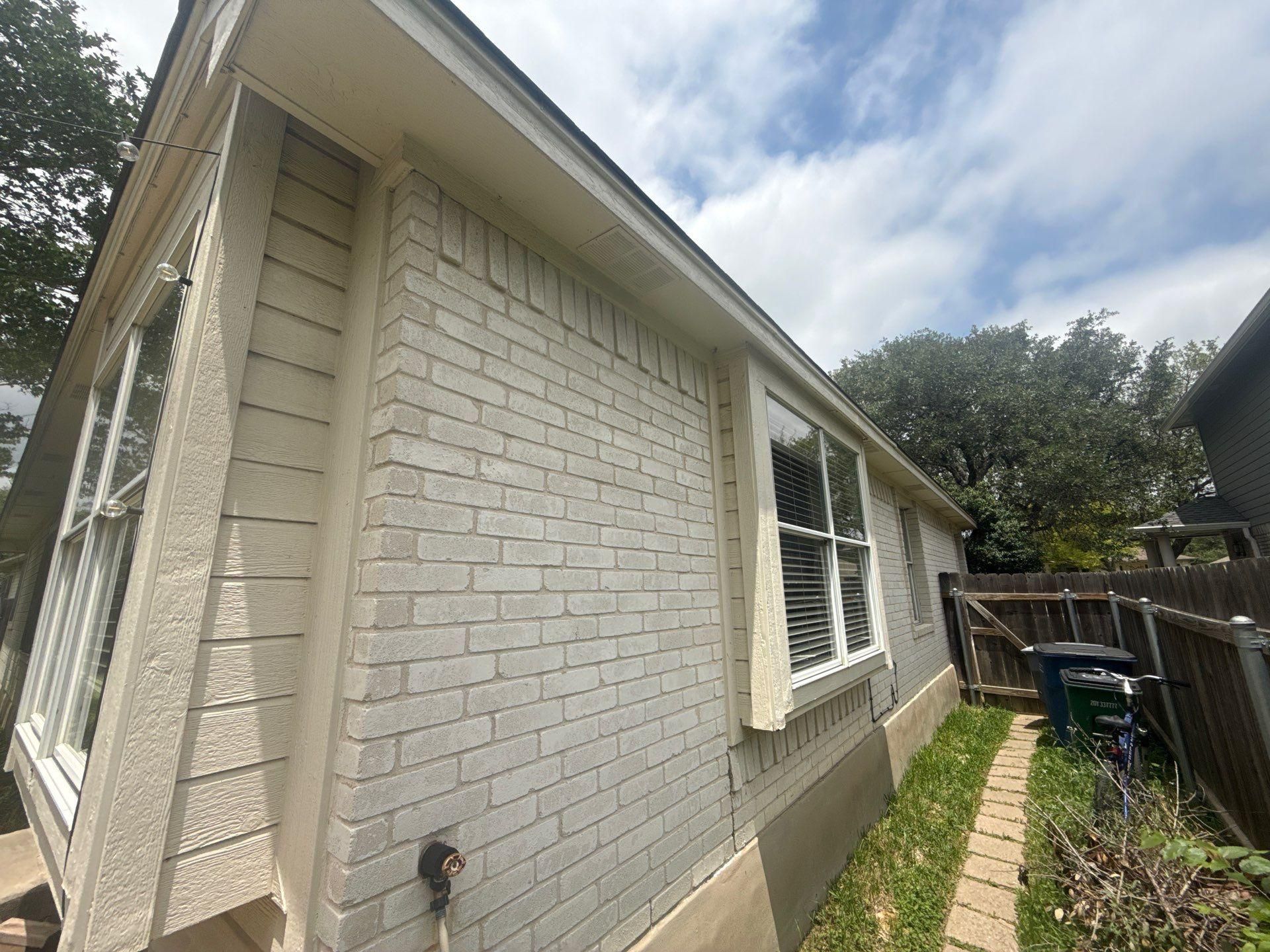 Exterior elevation of a home in Austin, TX ahead of exterior painting by Hill Country Painting