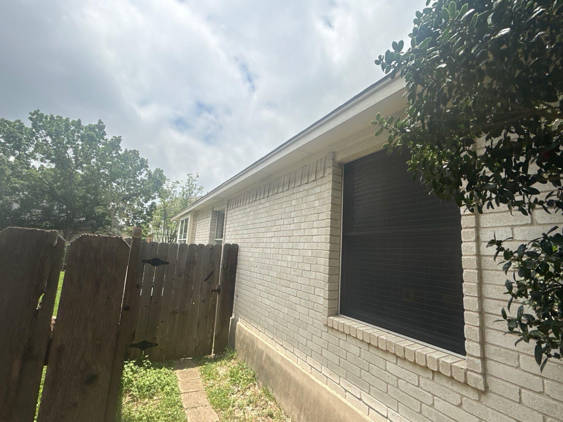 Exterior elevation of a home in Austin, TX ahead of exterior painting by Hill Country Painting