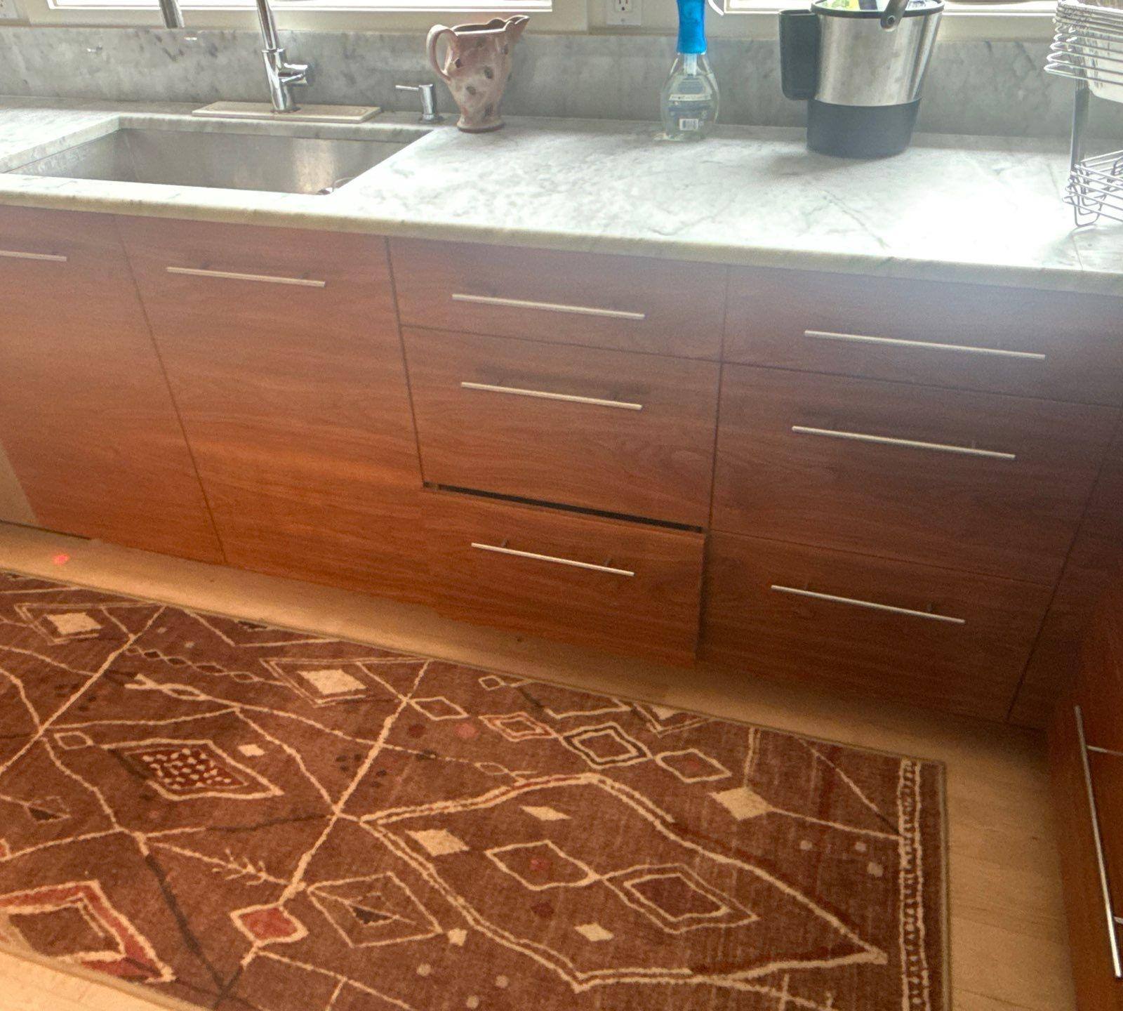 Kitchen cabinet drawers of a home in Austin, TX ahead of cabinet refinishing by Hill Country Painting
