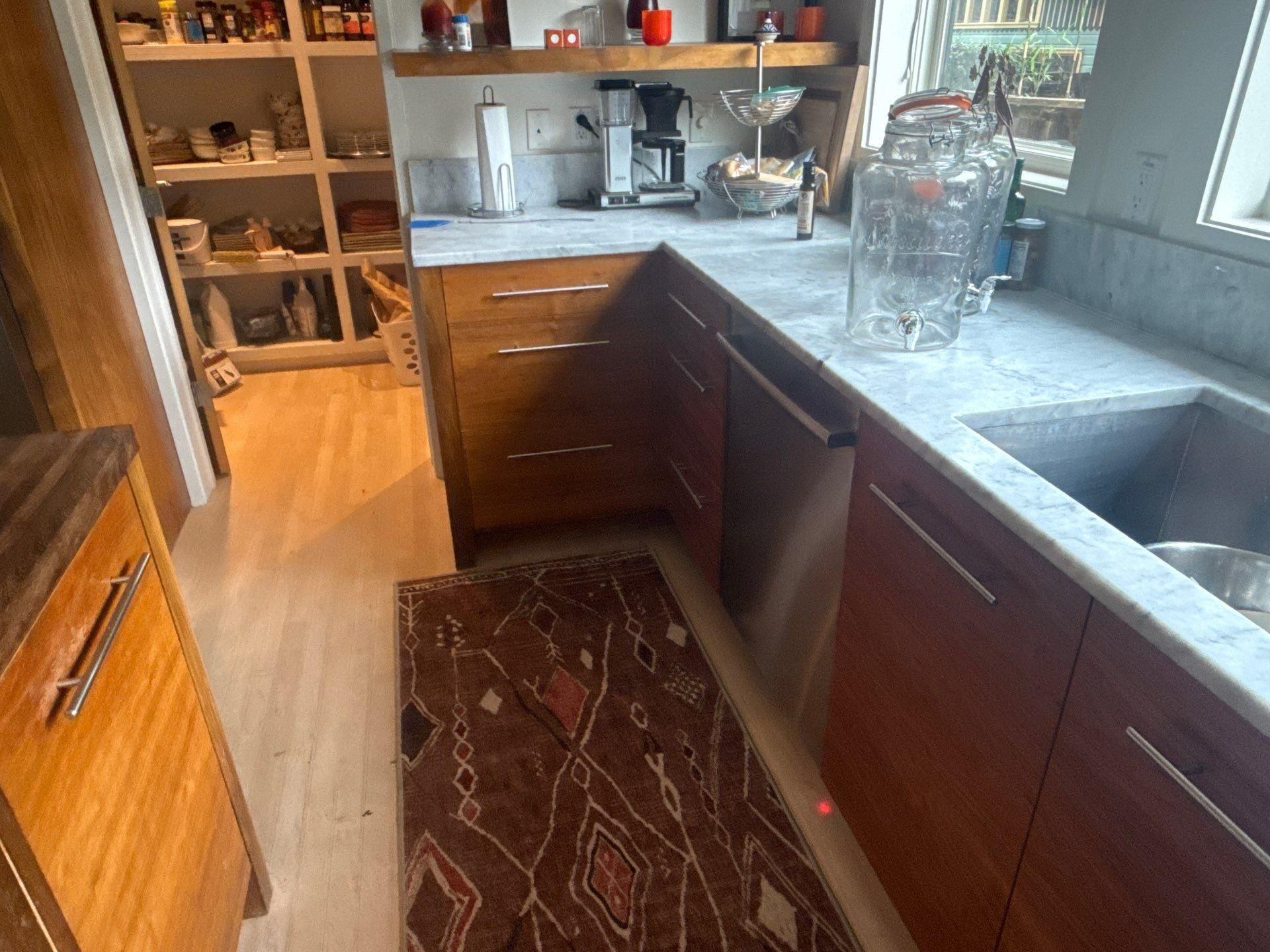Kitchen cabinet doors and drawers of a home in Austin, TX ahead of cabinet refinishing by Hill Country Painting