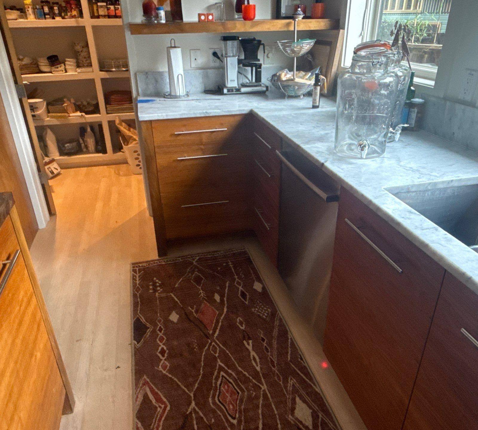 Kitchen cabinet doors and drawers of a home in Austin, TX ahead of cabinet refinishing by Hill Country Painting